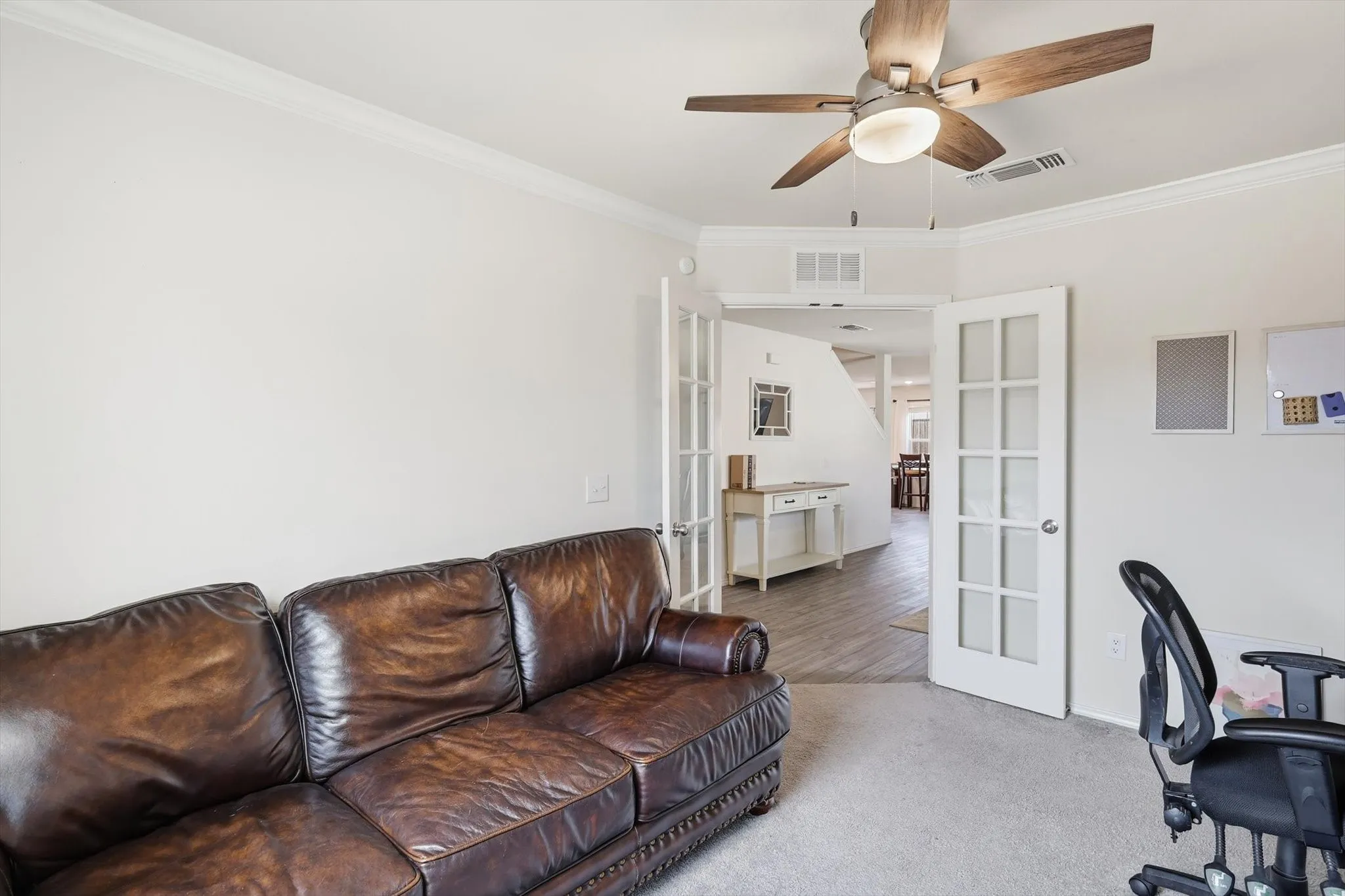 Office with french doors, crown molding, a ceiling fan, and carpet floors