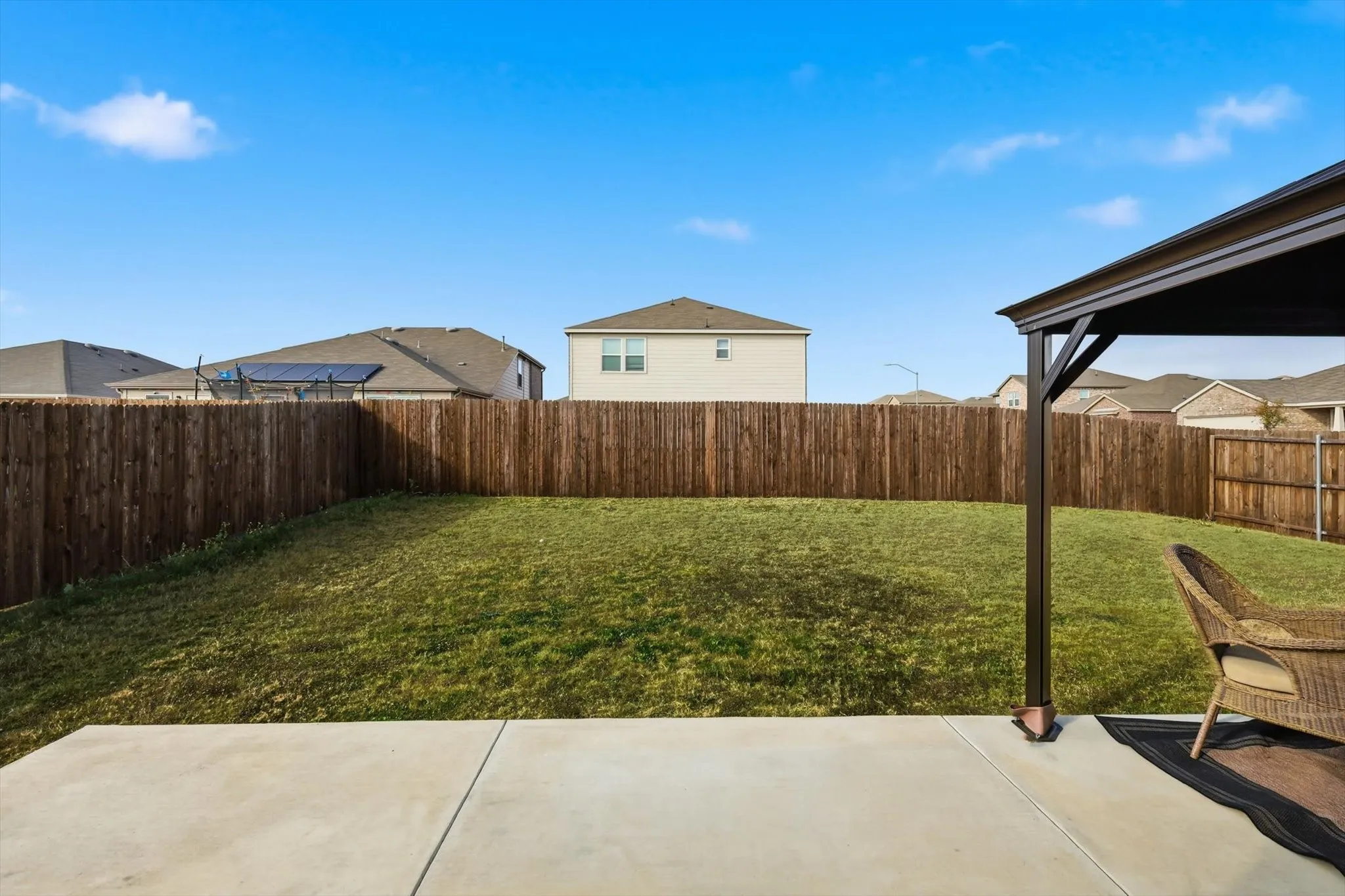 Fenced backyard featuring a patio area