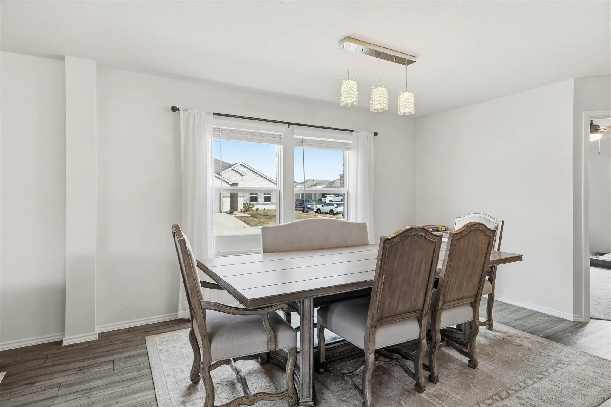 Dining room featuring wood finished floors and baseboards