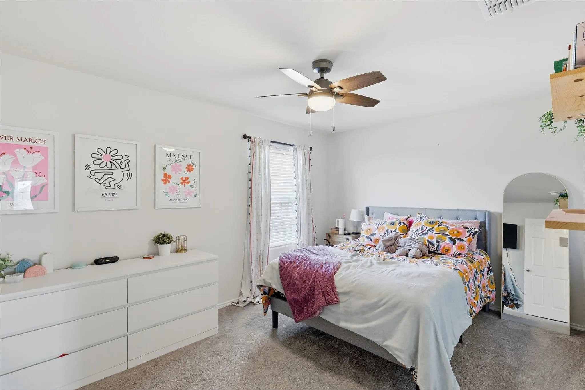 Bedroom featuring light colored carpet and ceiling fan