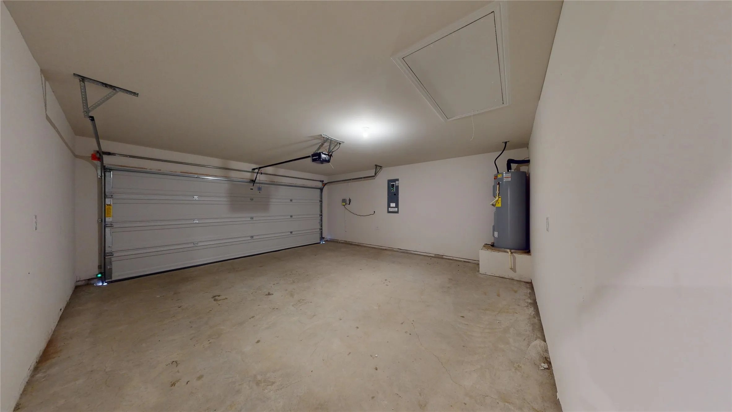 Garage with electric water heater and electric panel