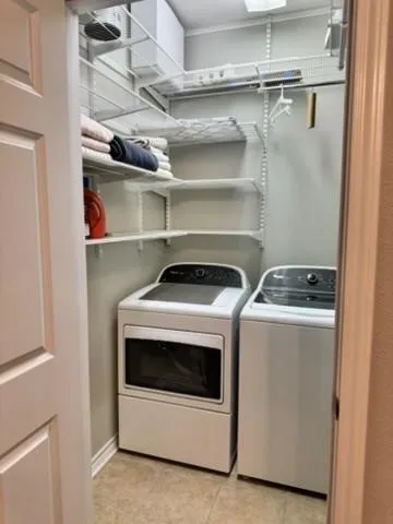 Washroom with washing machine and dryer