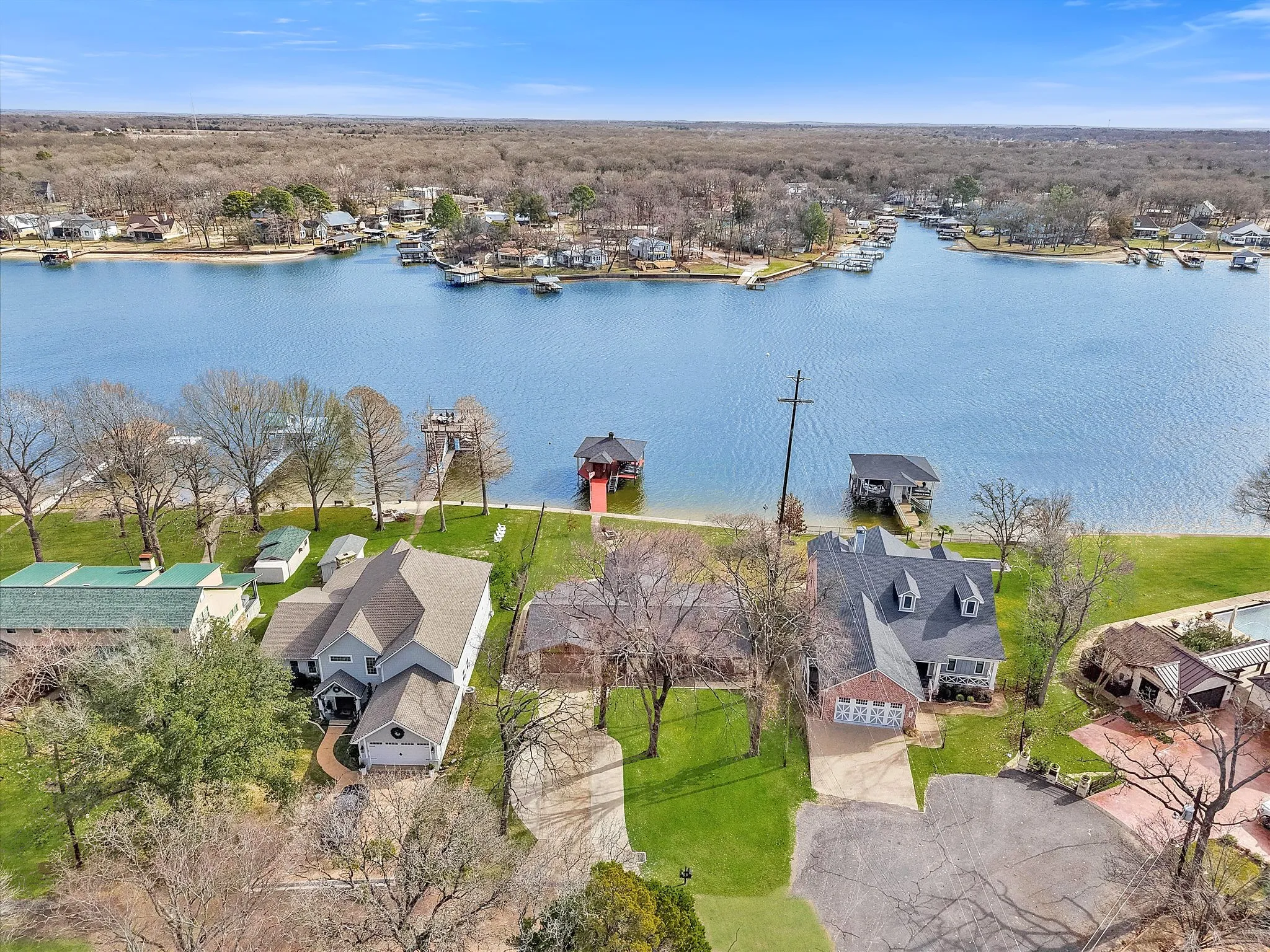 Aerial perspective of suburban area with a large body of water