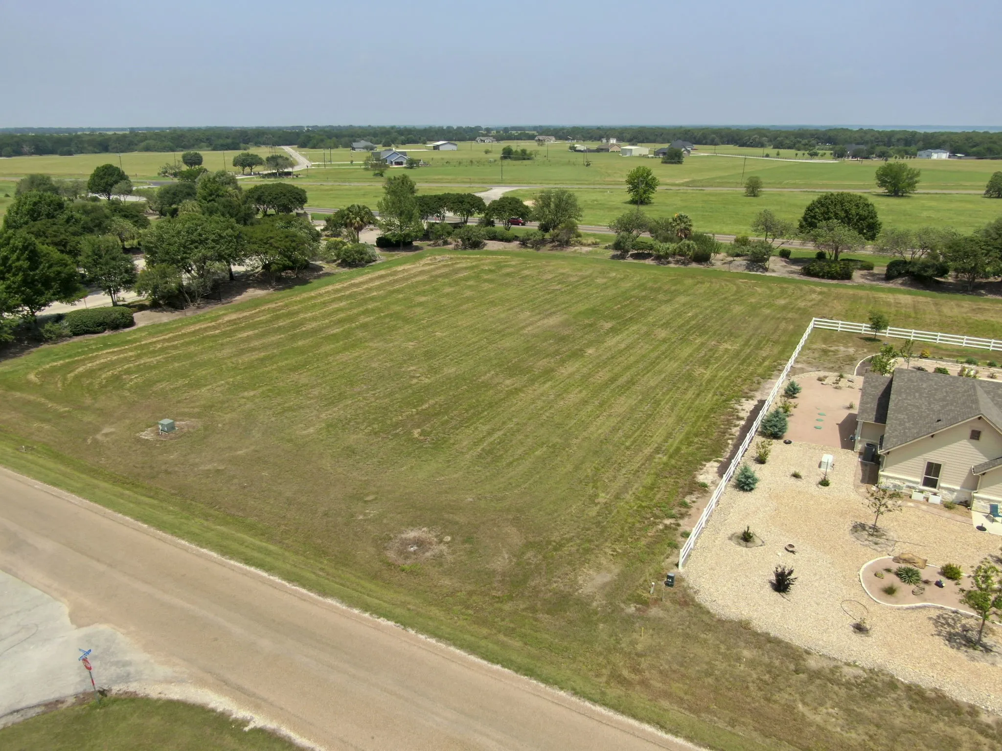 Expansive grass-covered lot featuring a level topography