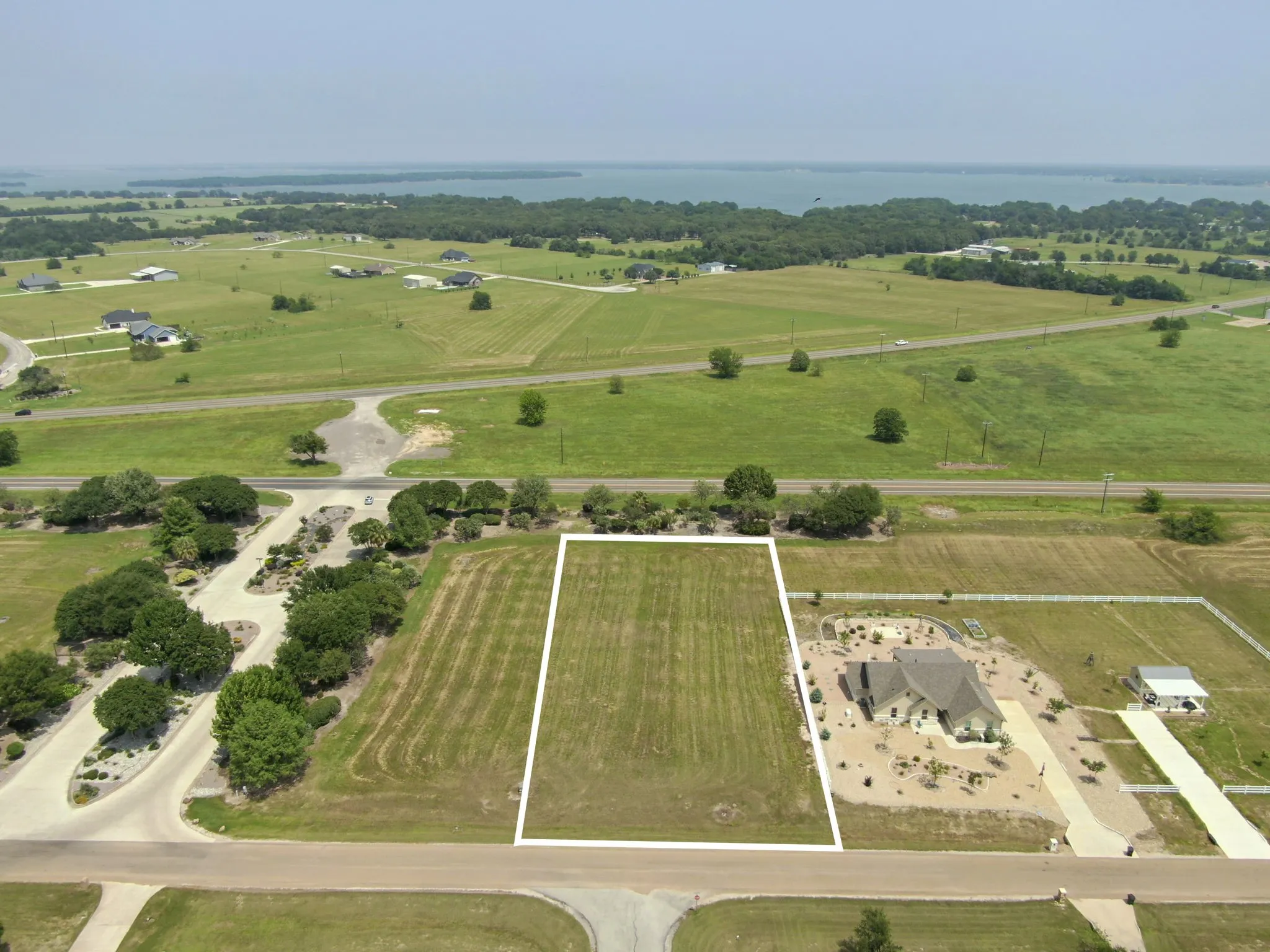 Cleared land lot featuring a level topography, street frontage, and established surrounding properties