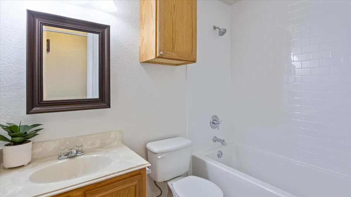 Hall bathroom with tub.