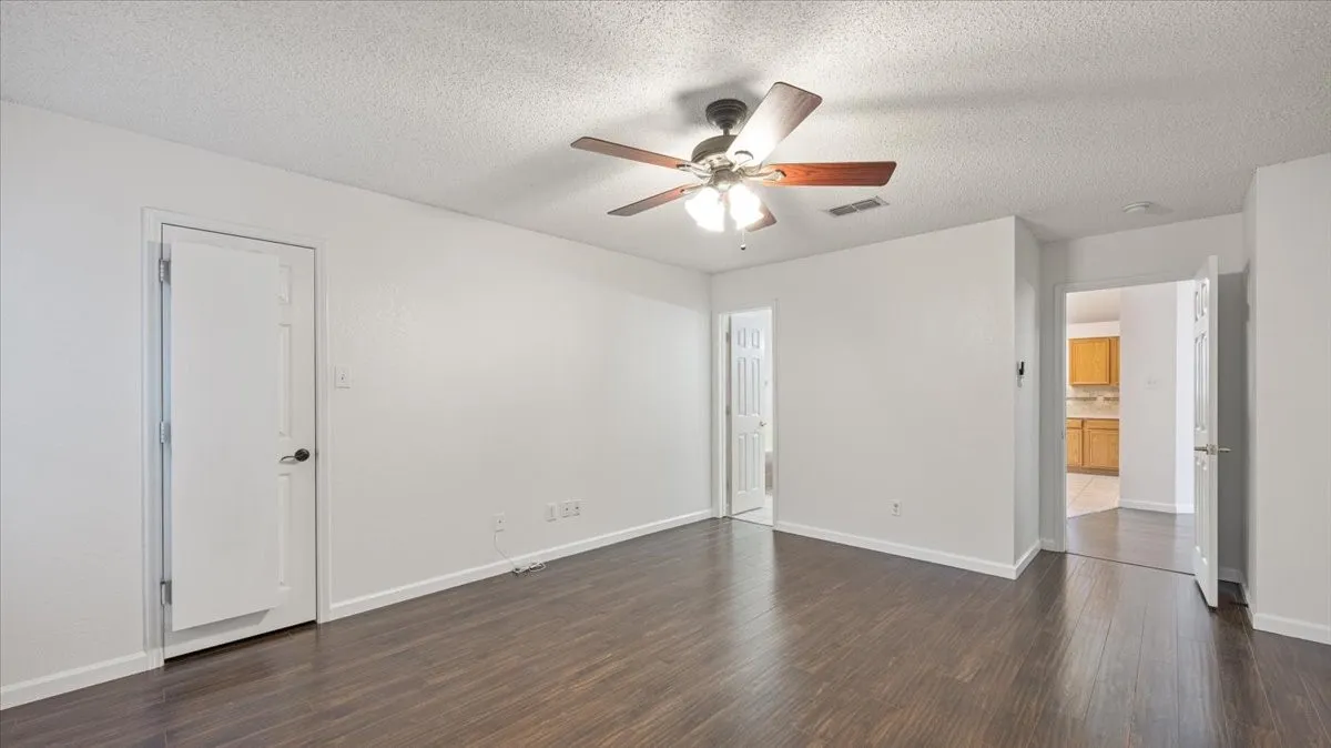 Another view of primary bedroom.