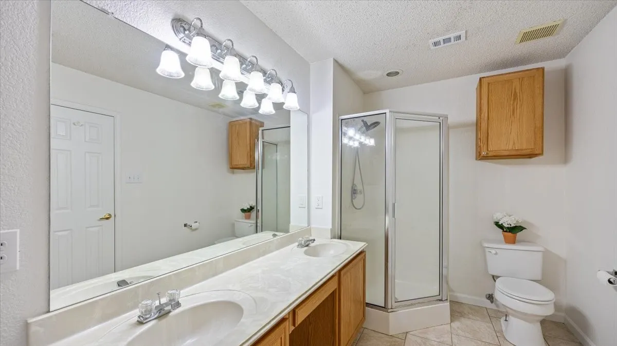 Full bathroom featuring separate shower.