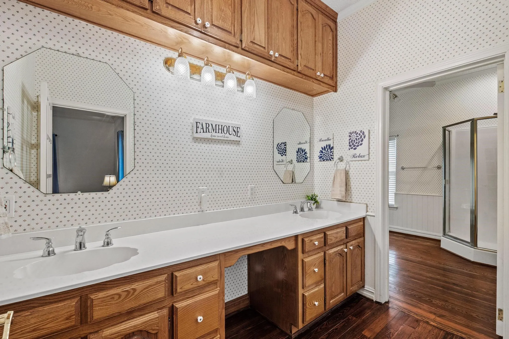 The primary bath has a separate vanity area with lots of storage space