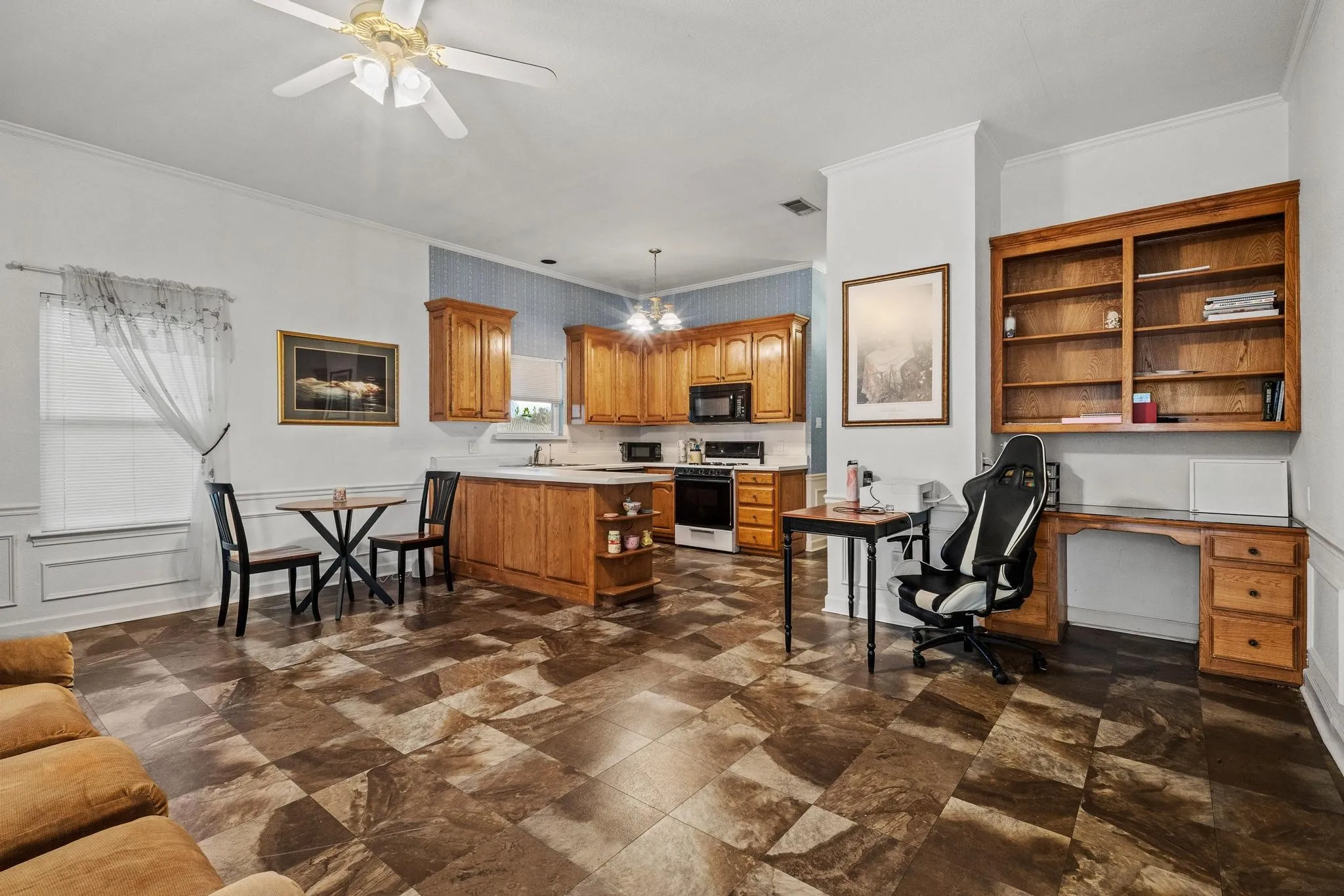 Living/Dining area of the 791 sq ft separate apartment (ADU) with full kitchen. Note the built-ins.