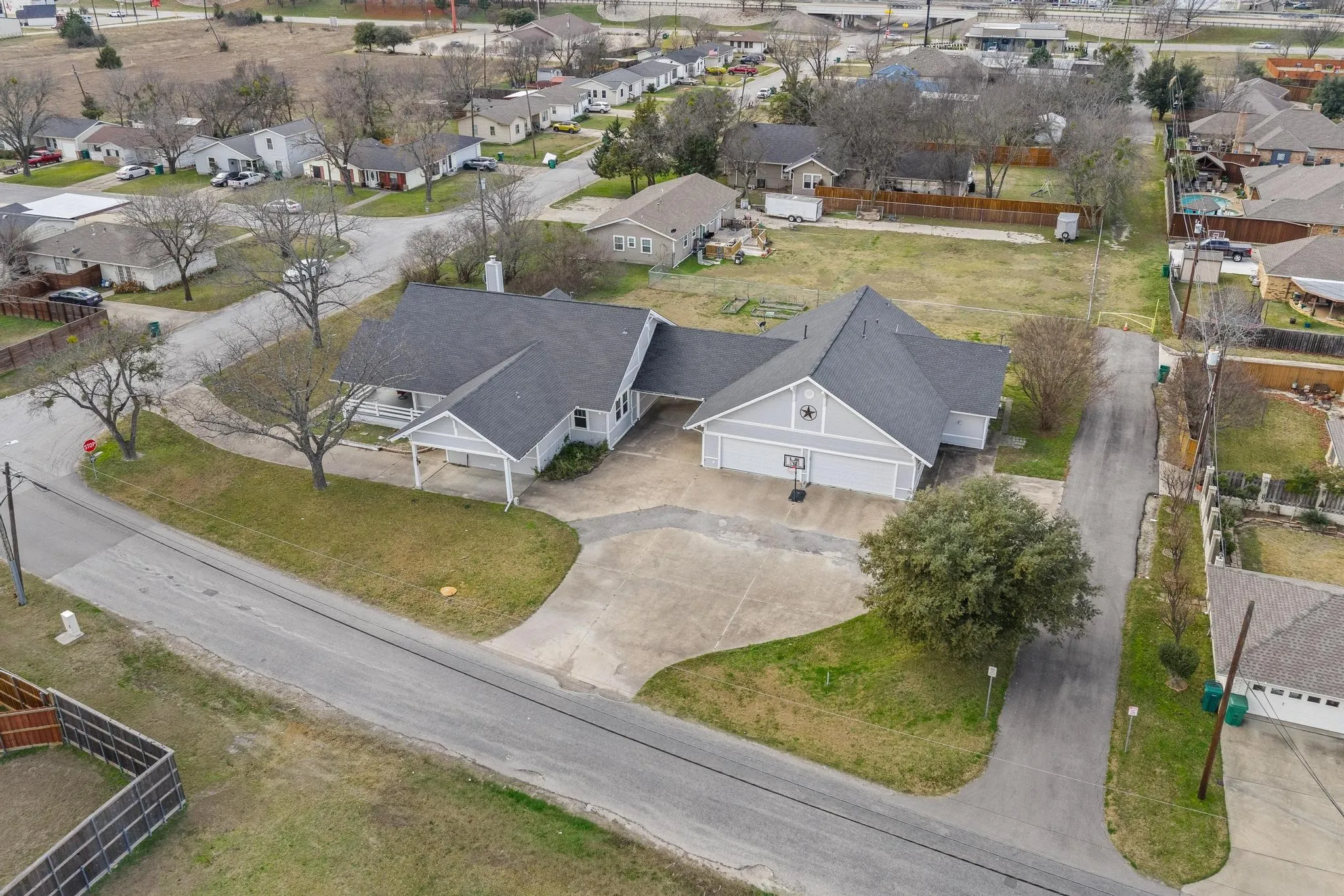 Aerial view of the property - note the abundance of parking along with the 4 car garage