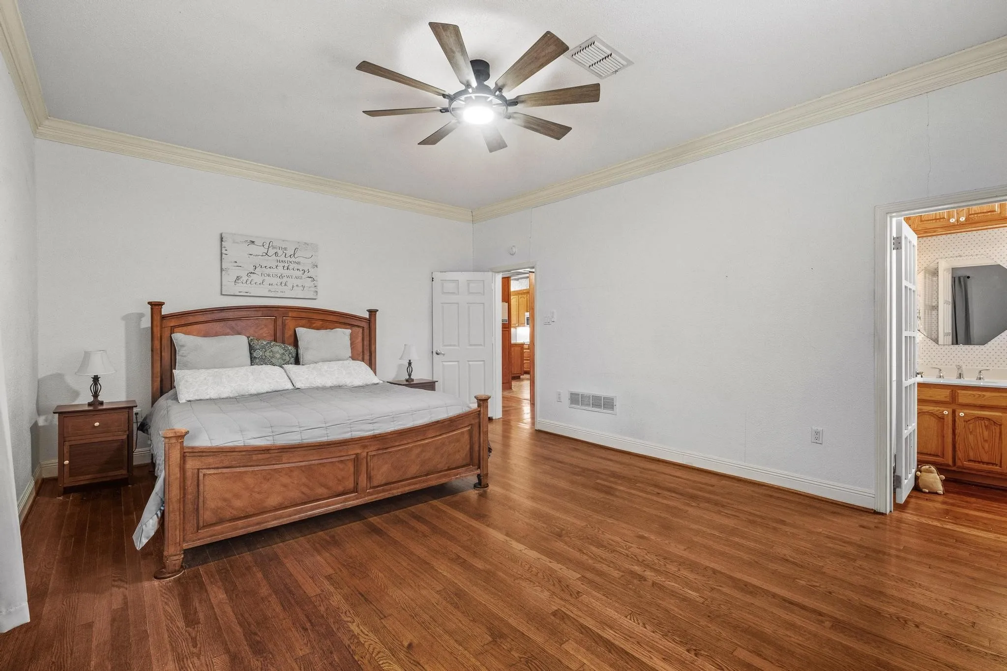 Note the original hardwood floors in the primary suite