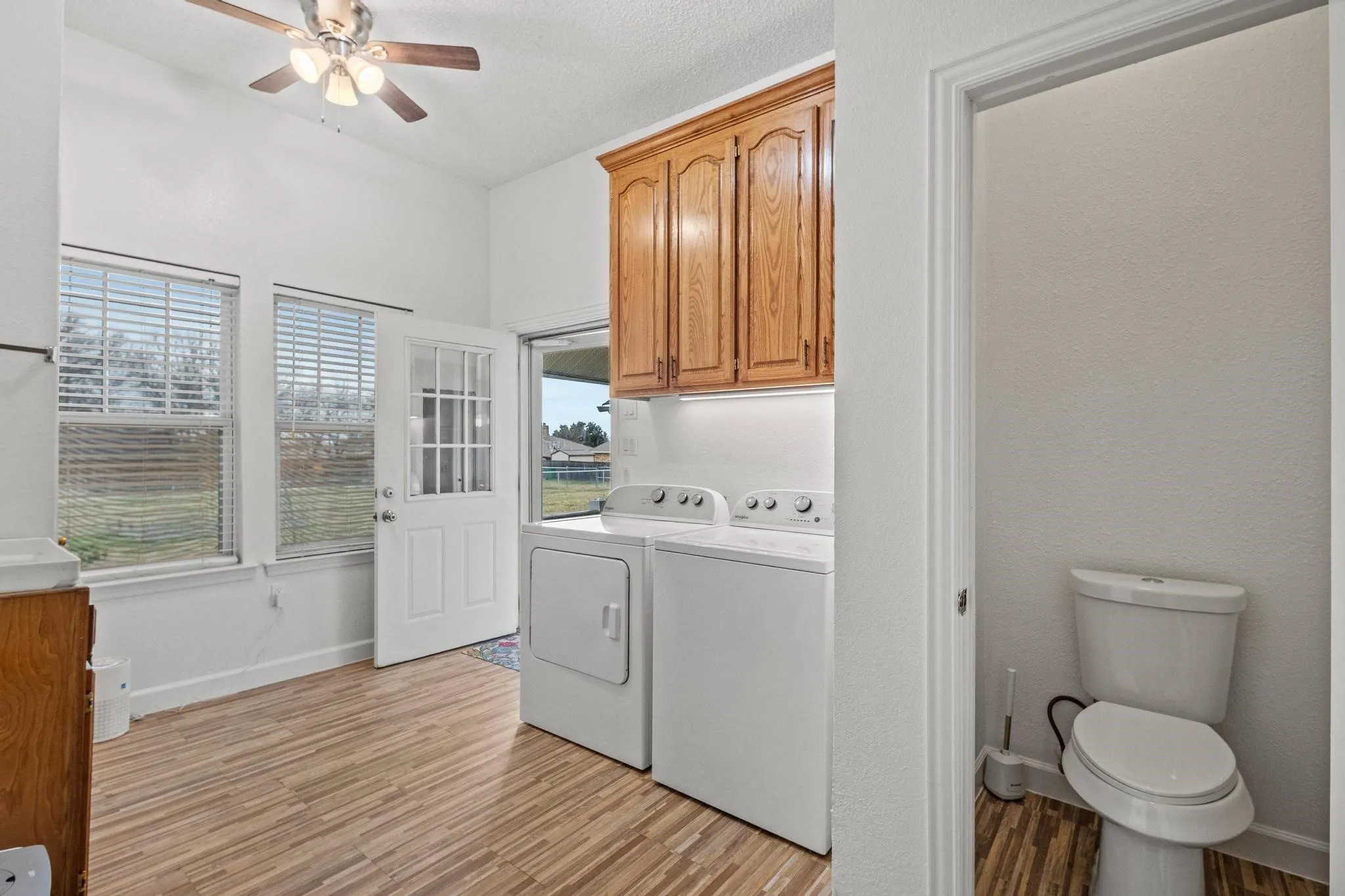 10'x14' utility room with sink, toilet room and room for fridge/freezer connects the main home to the breezway and the ADU