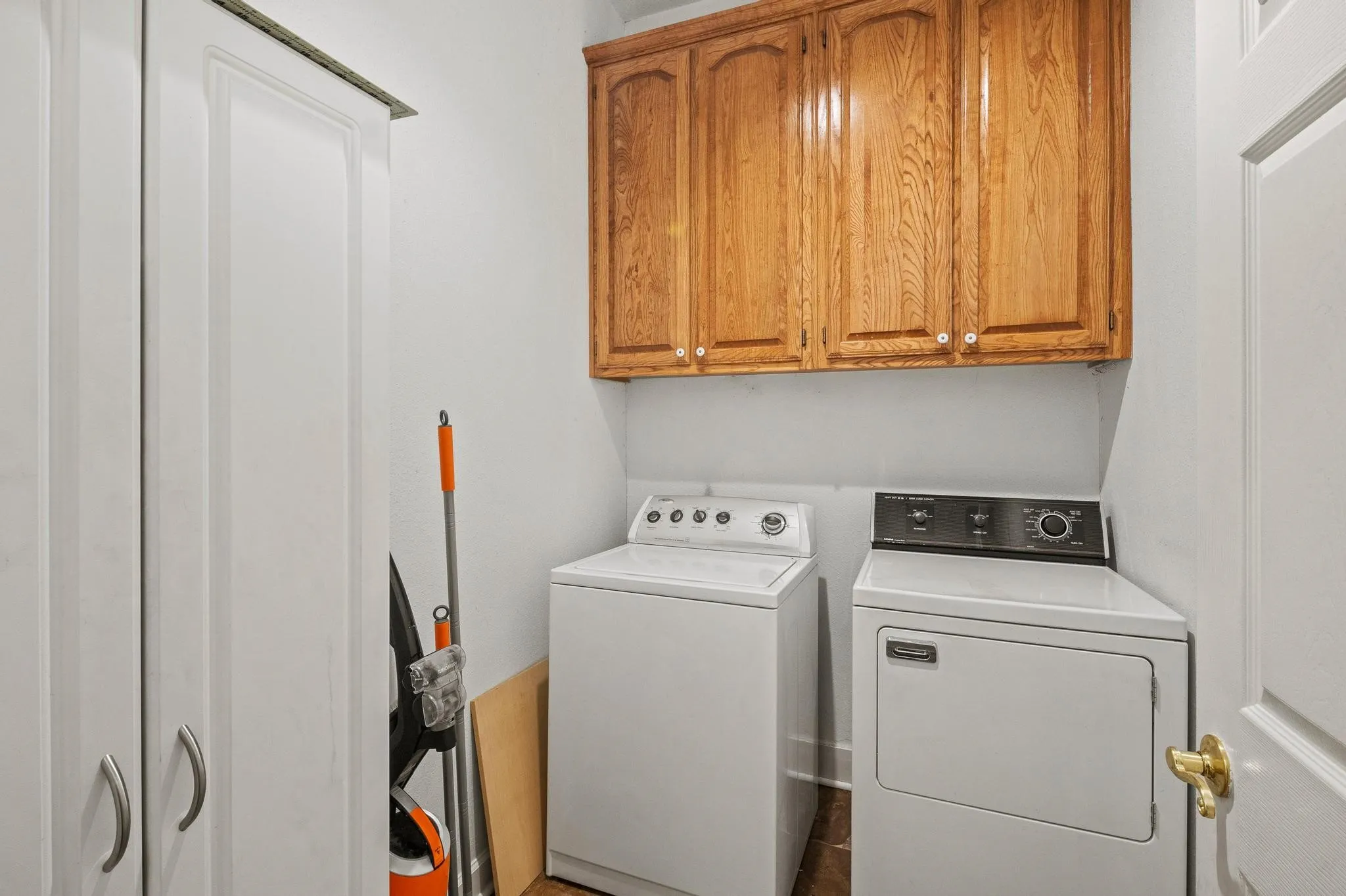 Separate utility room in the separate guest quarters/apartment (ADU) with storage and full-size W/D area