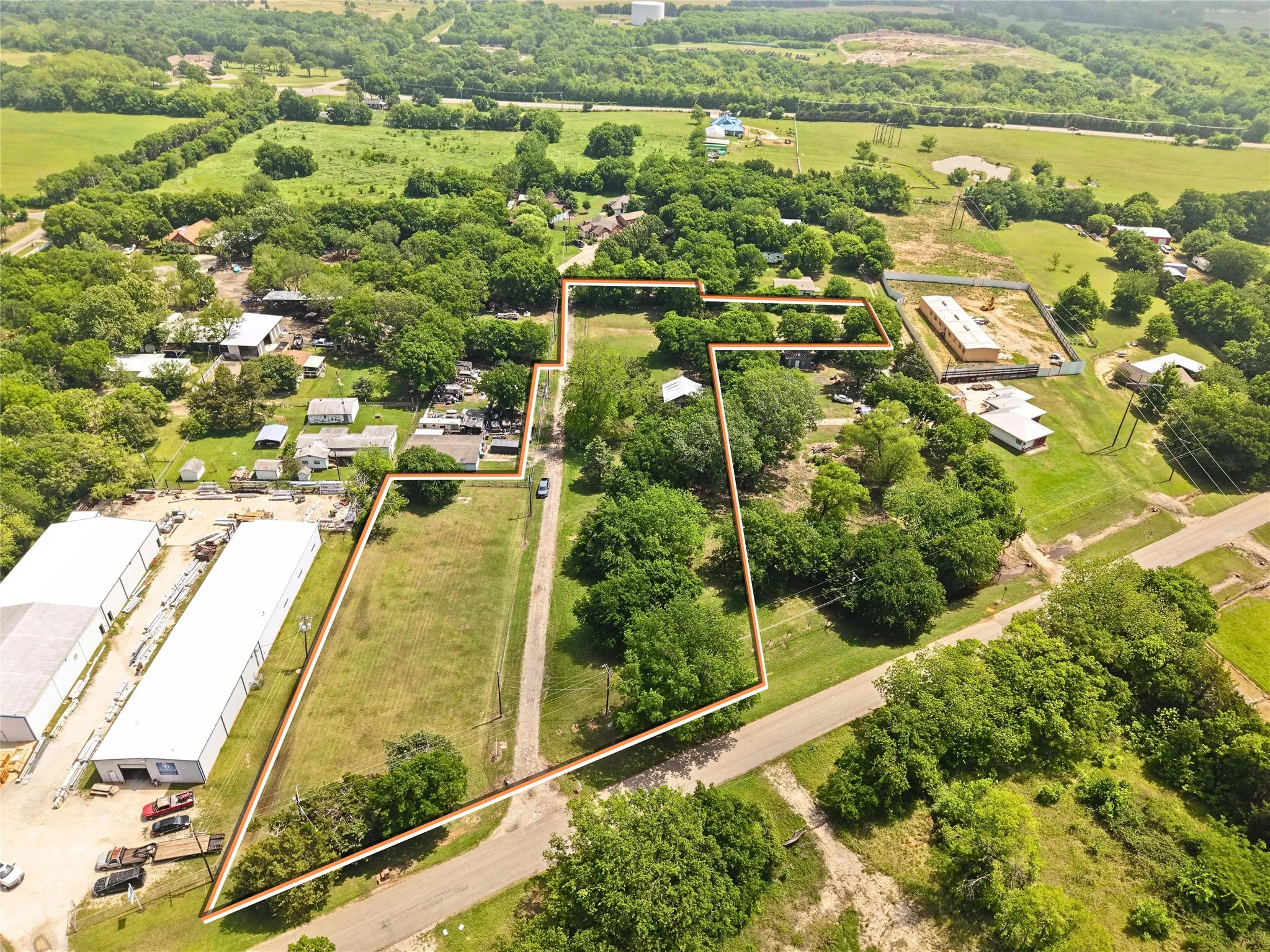 Expansive lot featuring a mix of cleared land and mature trees