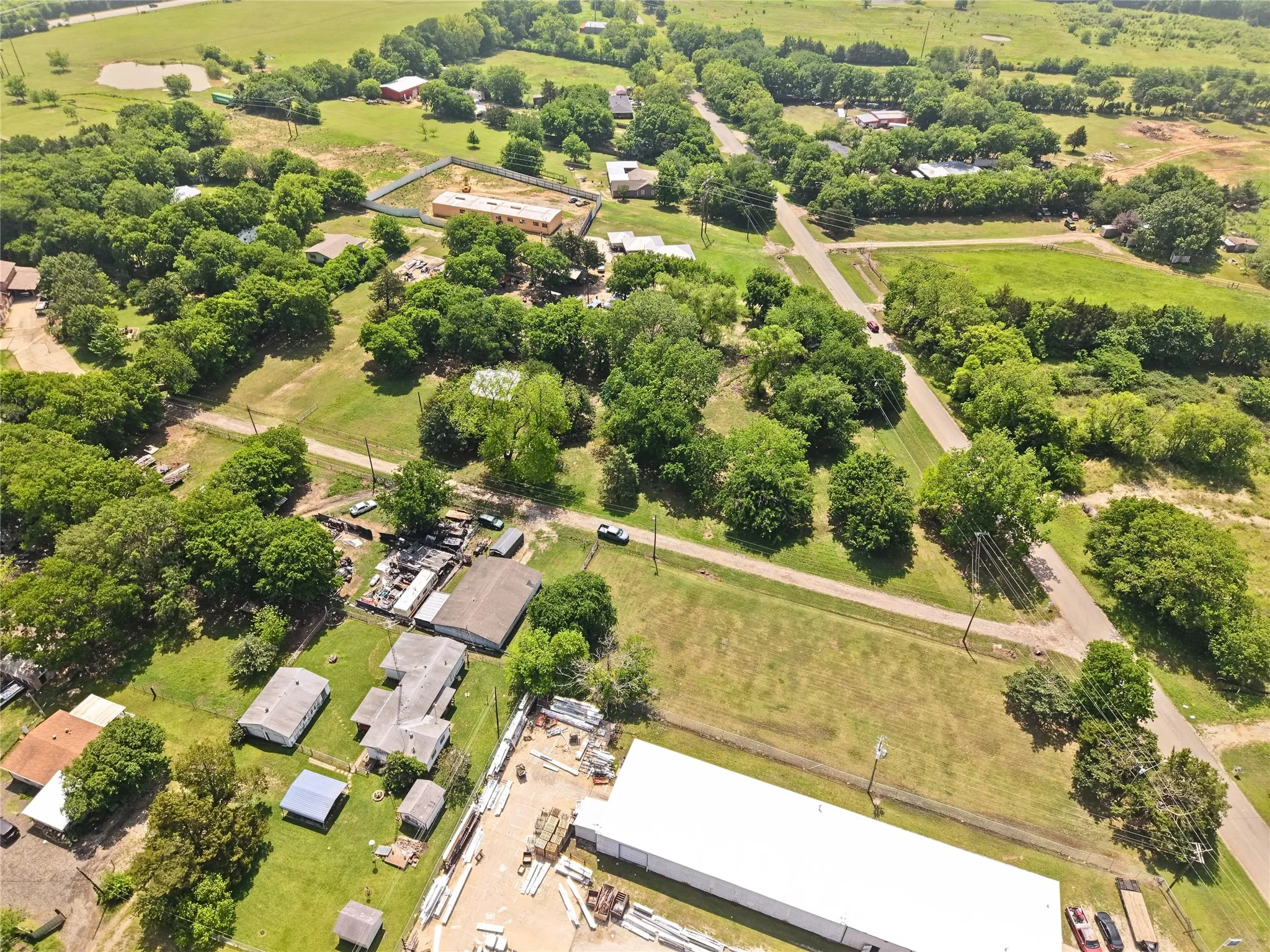 Expansive property featuring a mix of cleared land and mature trees