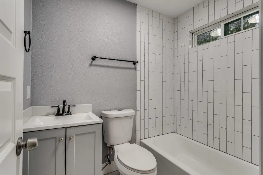 Bathroom featuring vanity and a shower / bathtub combination