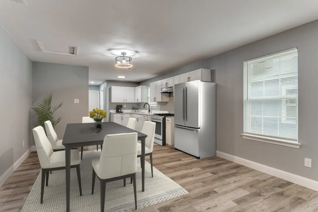 Virtually staged kitchen and dining area. House  comes with a different refrigerator and stove than pictured.