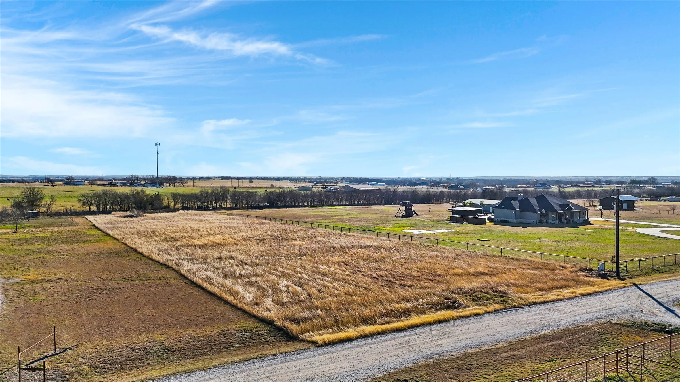 View from High Mesa Rd looking southeast onto the property.