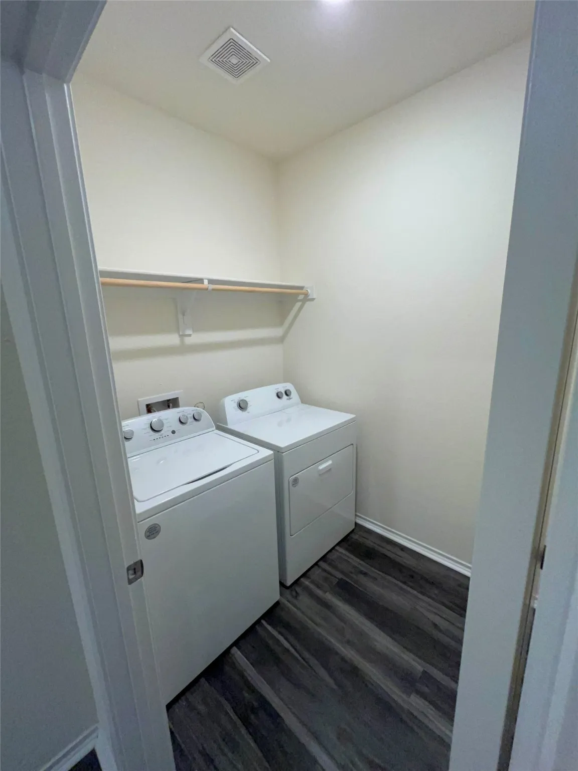 Laundry area featuring full washing machine and dryer hookup.