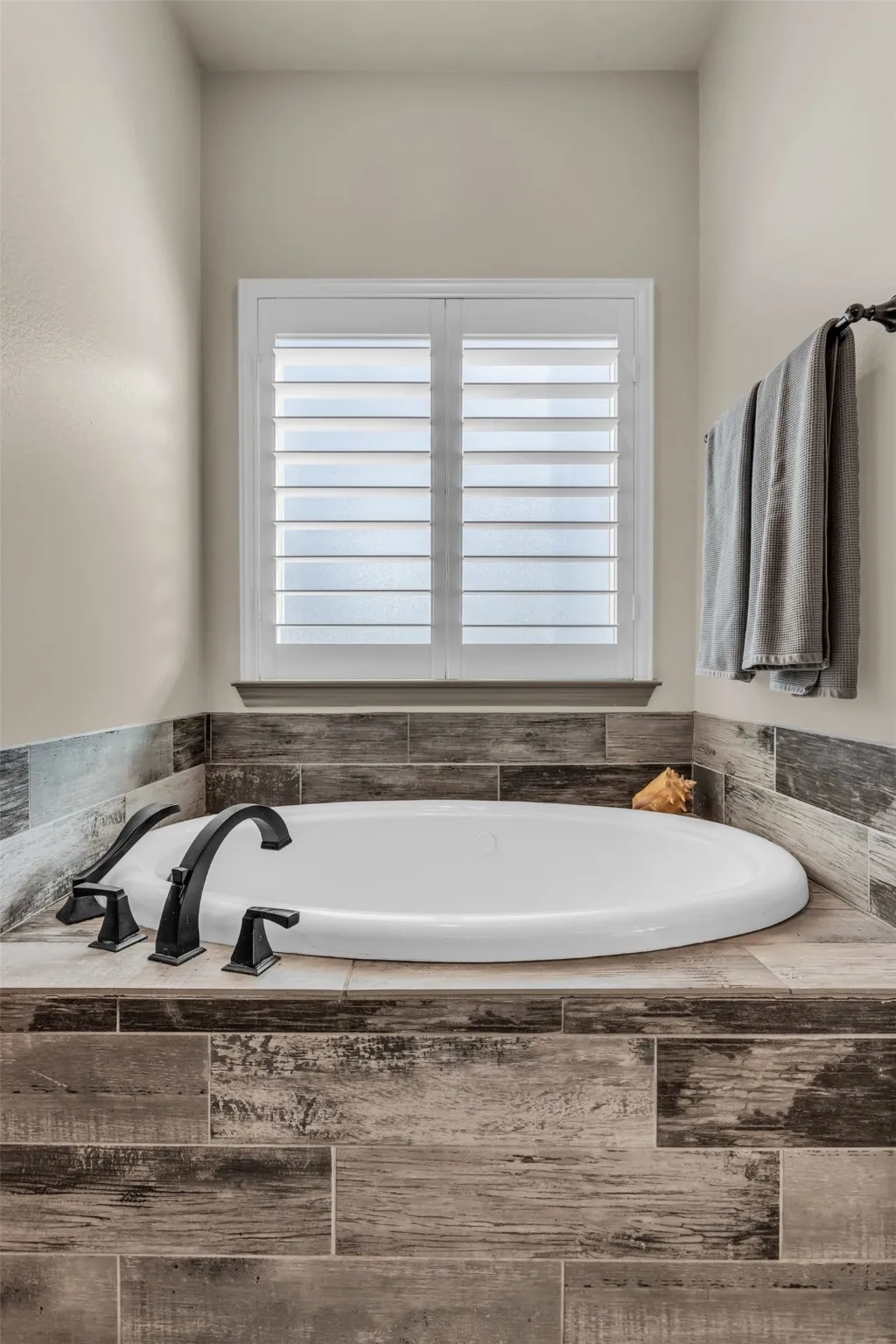 Bathroom featuring a bath and healthy amount of natural light