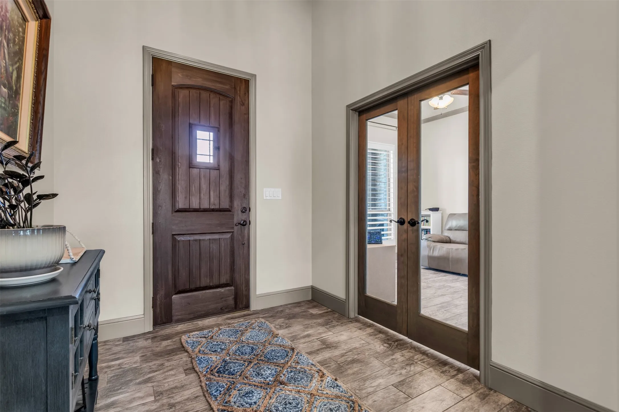 Foyer featuring wood finished floors and french doors