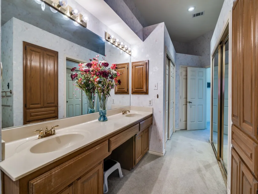 Full bathroom featuring double vanity