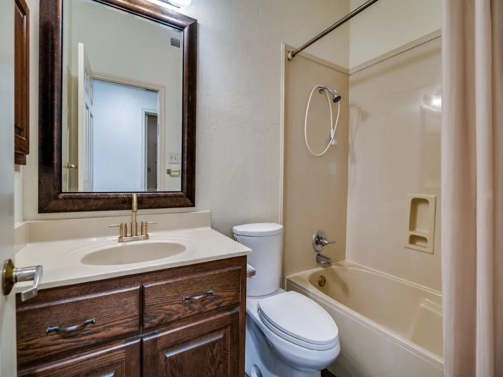 Bathroom with shower / washtub combination and vanity