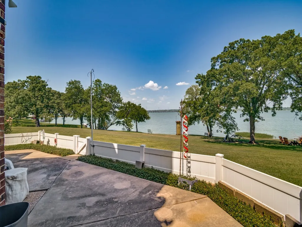 View of patio with a water view