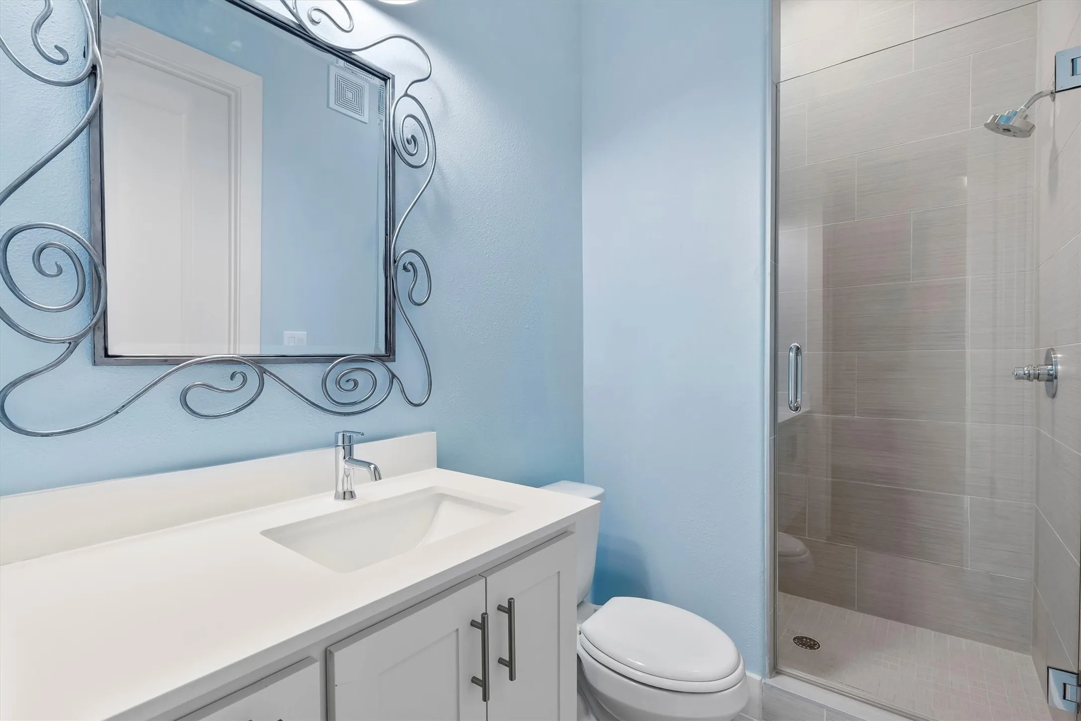 Full bath featuring vanity and a stall shower