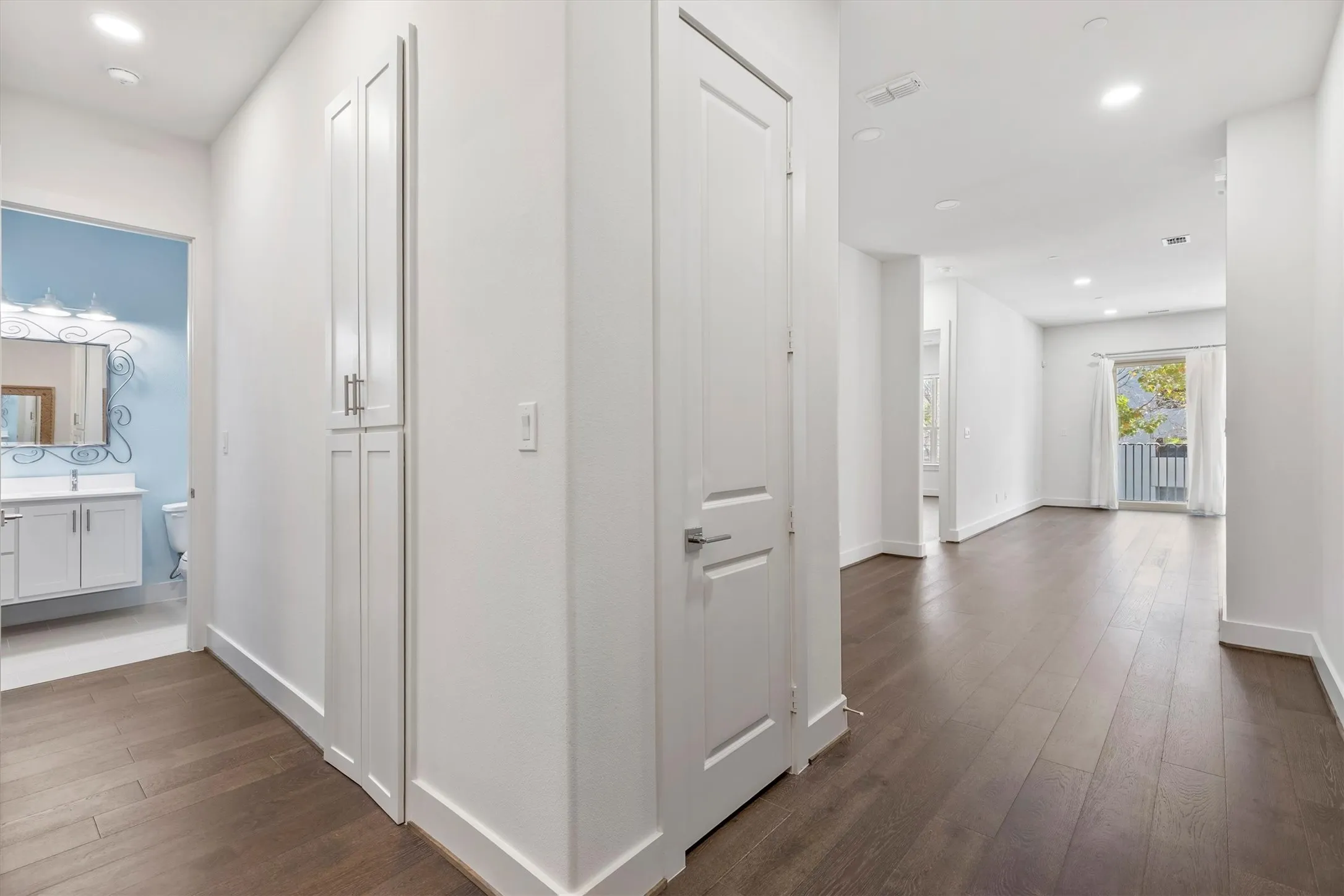 Hall with recessed lighting and dark wood  floors