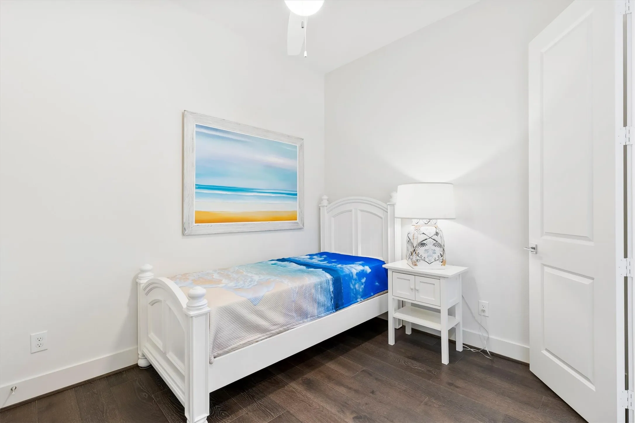 Bedroom featuring dark wood finished floors and ceiling fan. *staged to show potential*
