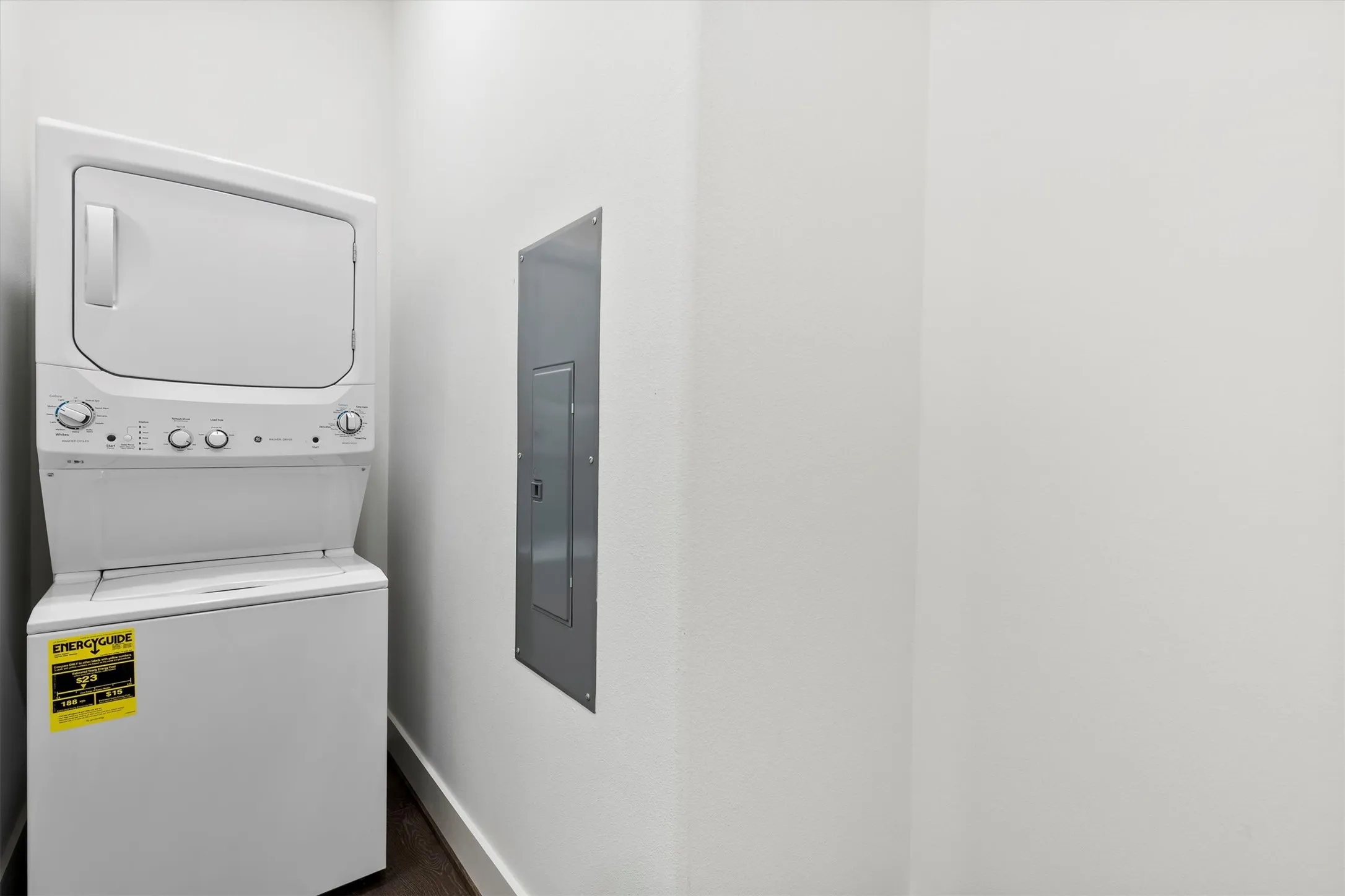 Separate Laundry room inside the unit with stacked washer / dryer (included) and electric panel