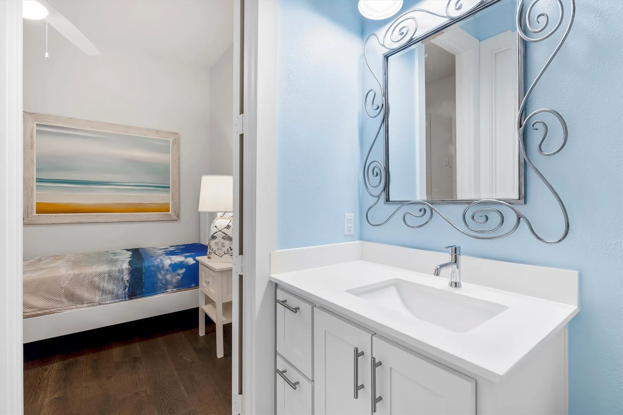 Bathroom featuring vanity and dark wood flooring