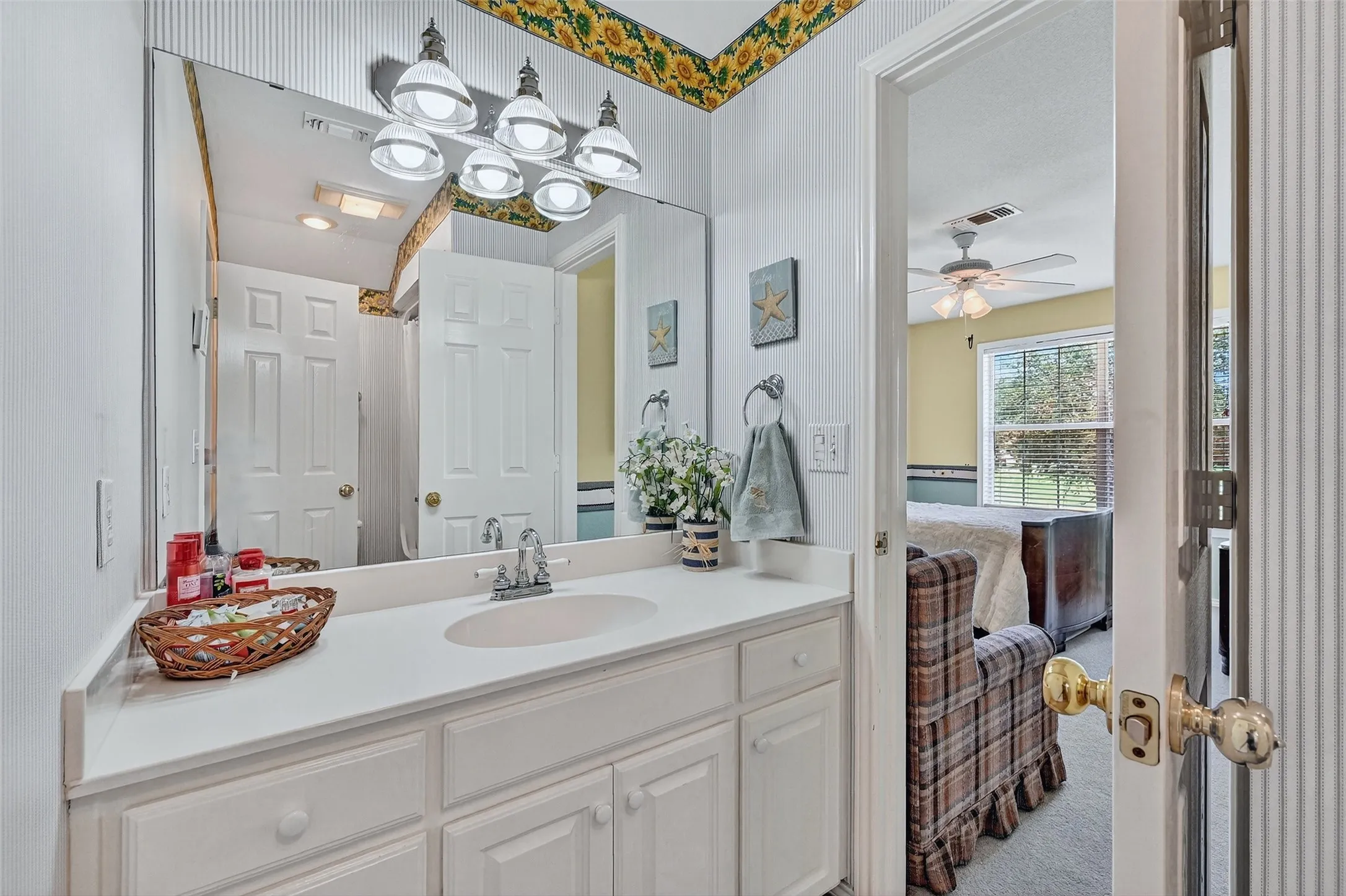 Bathroom featuring vanity and ceiling fan