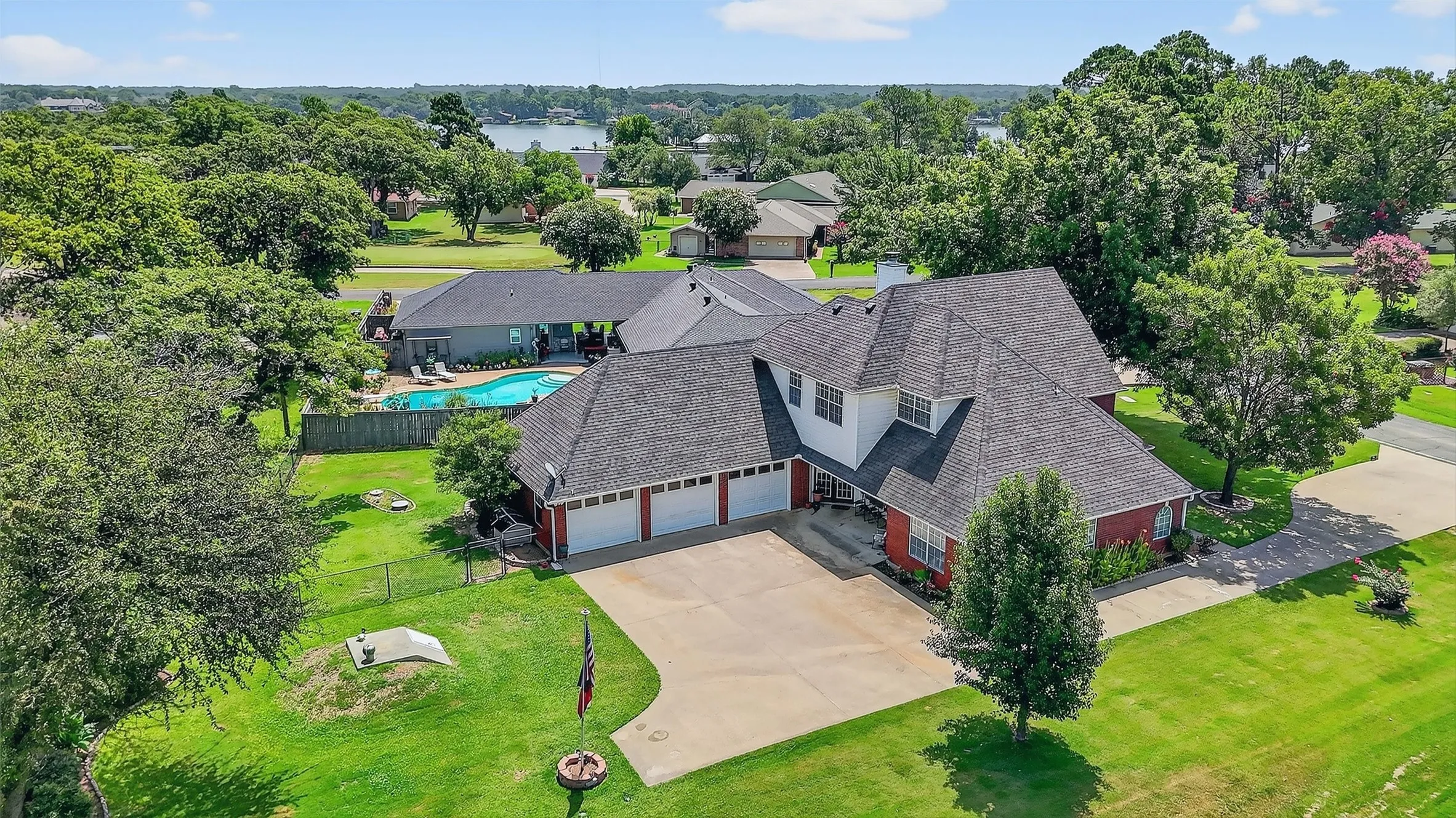 View of subject property featuring a pool area