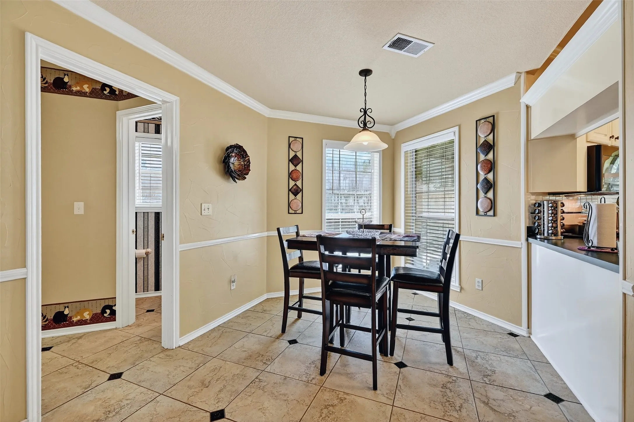 Dining area featuring ornamental molding