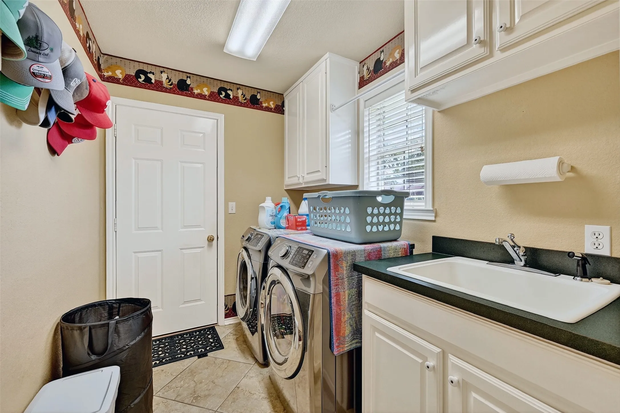 Laundry room featuring cabinet space and washer and dryer
