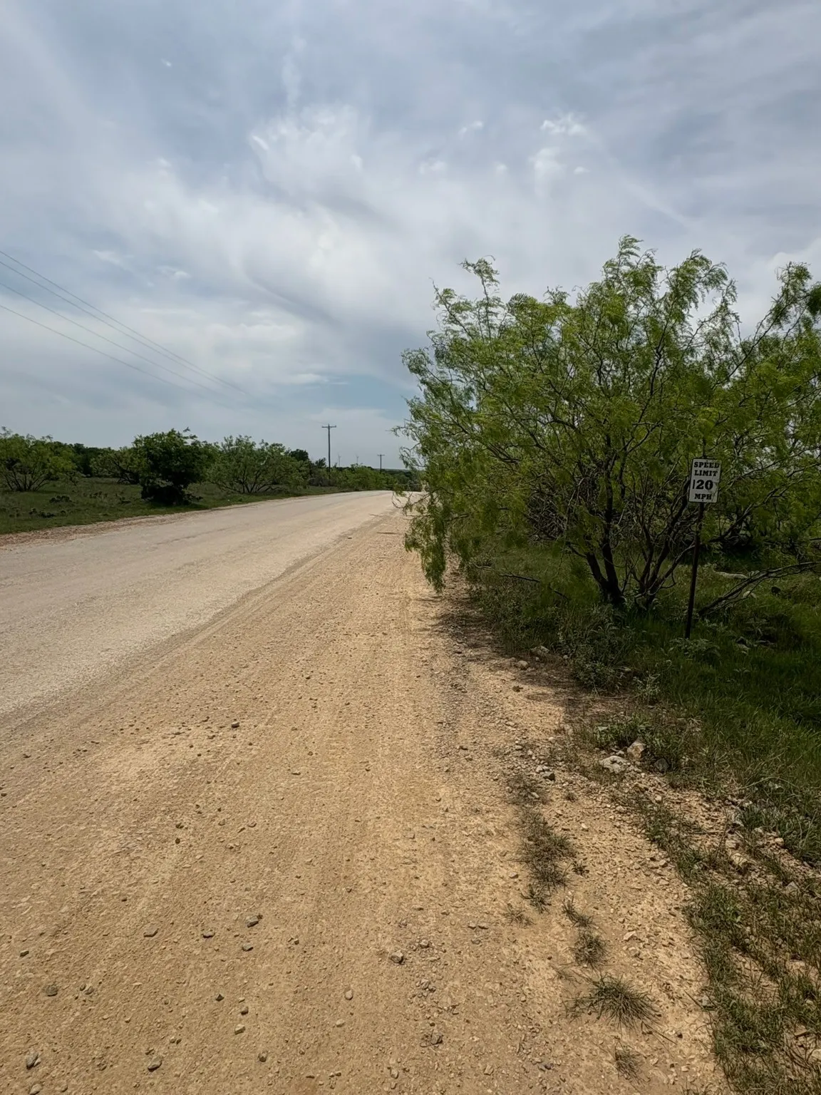 There is an all weather road that bi-sects the property.  Cattle guards on both entries.