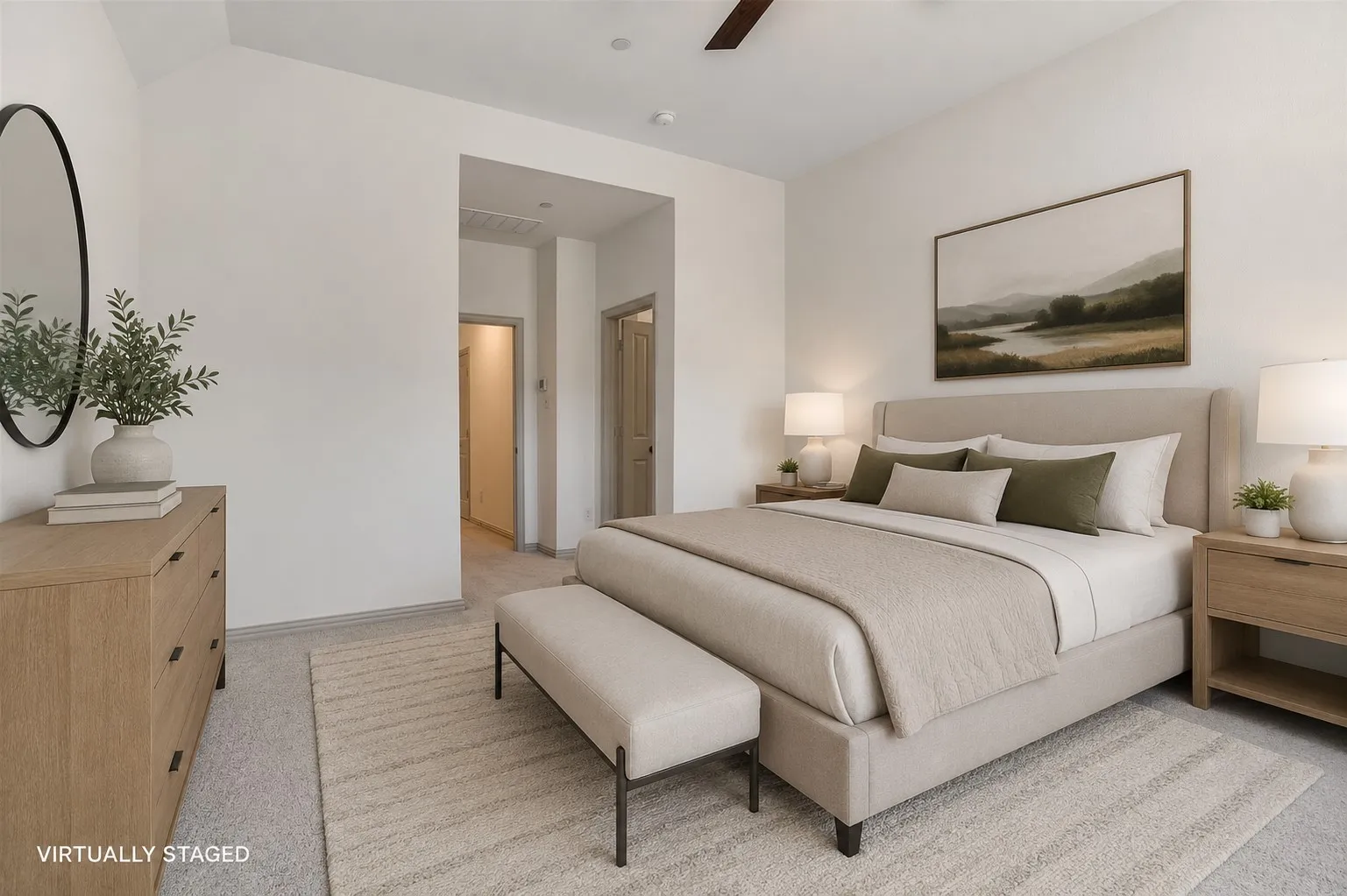 Carpeted bedroom featuring a vaulted ceiling and a ceiling fan