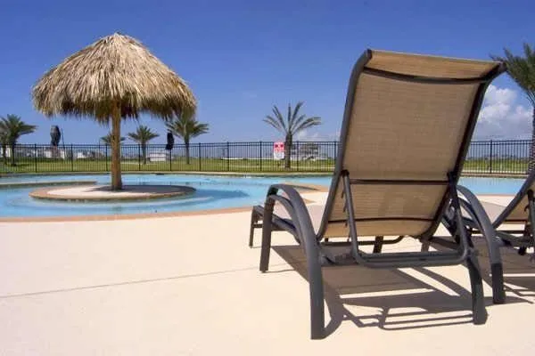 Surrounding community with a patio and a swimming pool