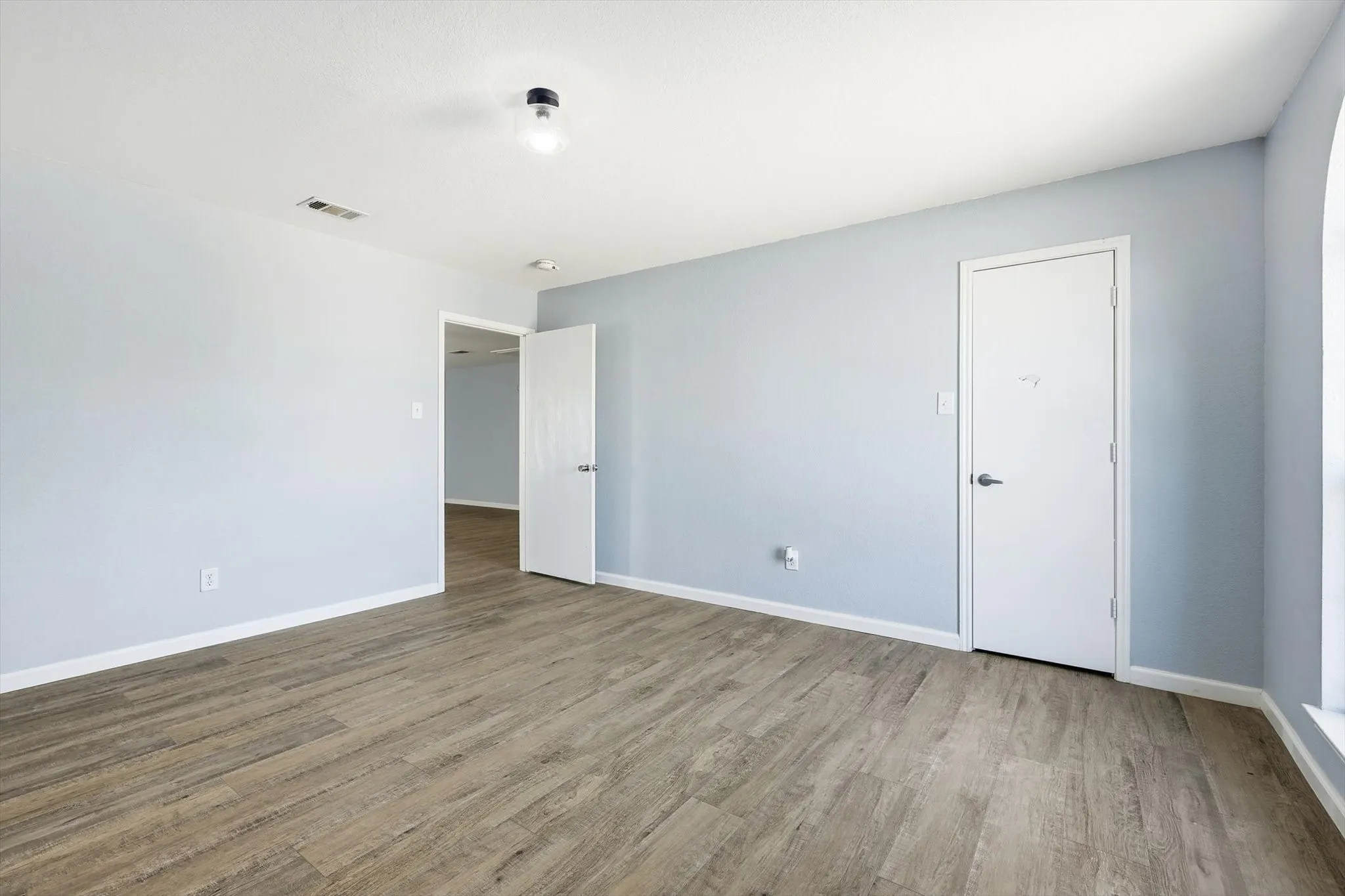 Unfurnished room featuring wood finished floors