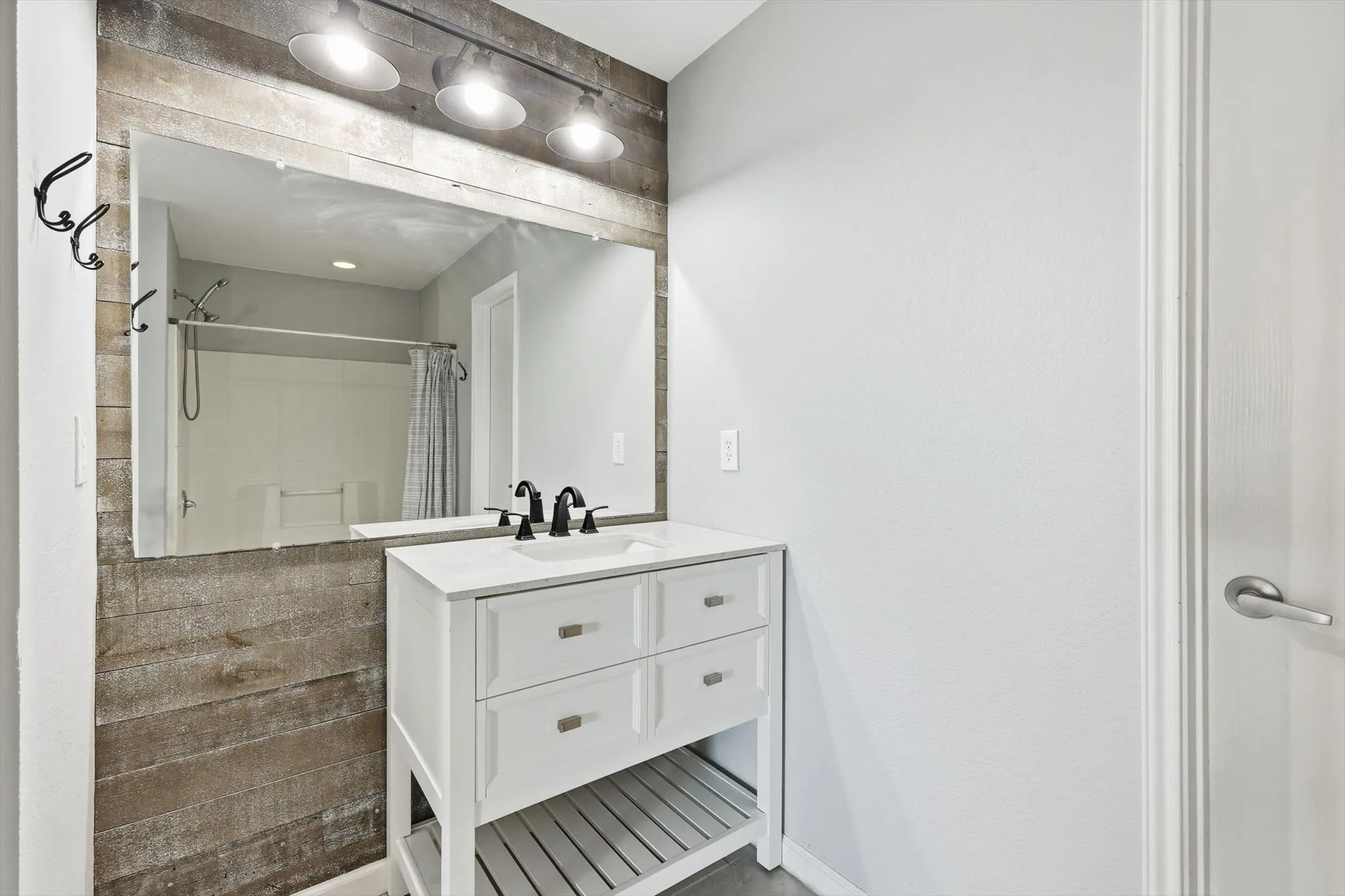 Full bathroom featuring shower / bath combo and vanity