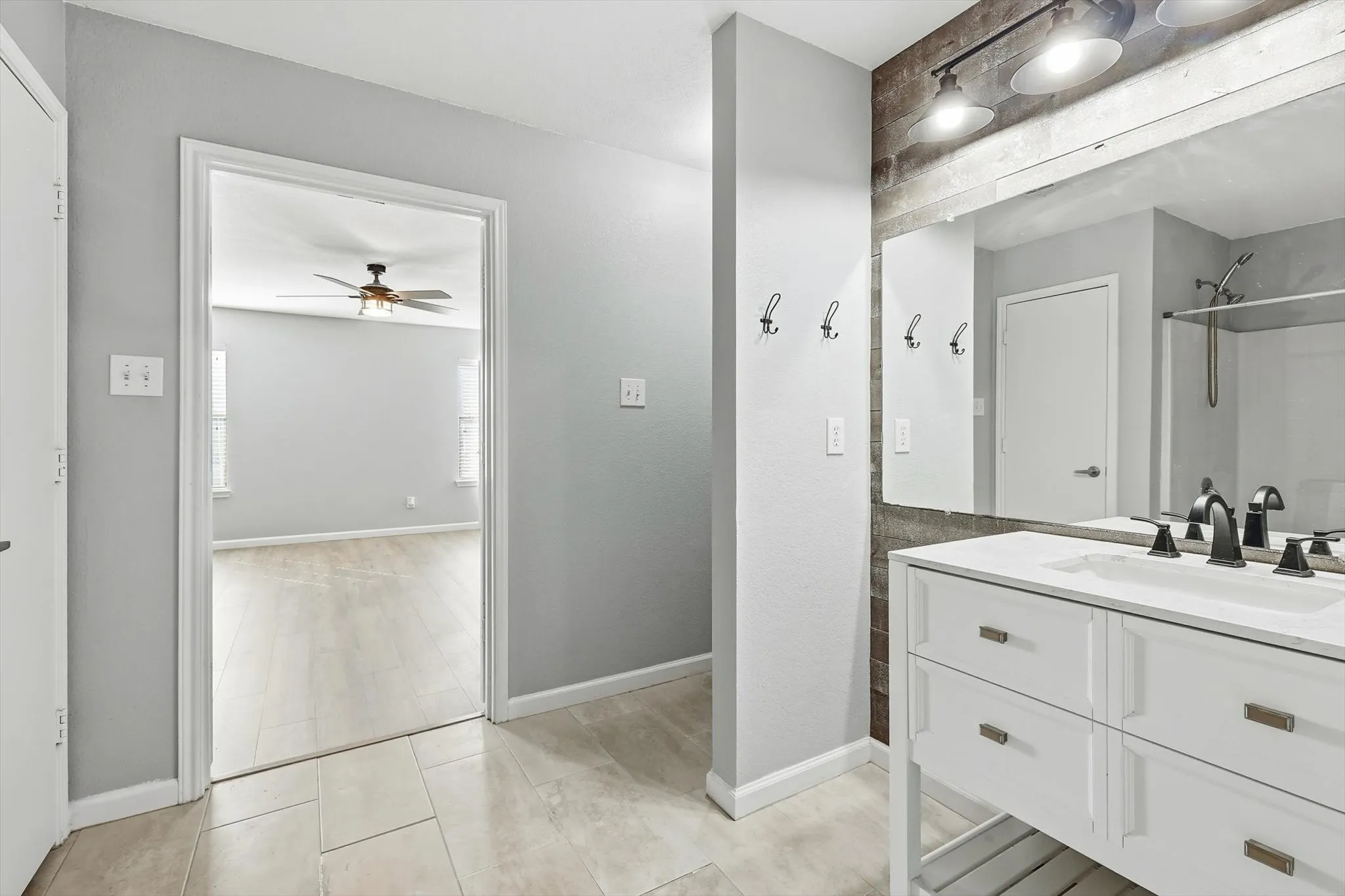 Full bathroom featuring shower / bath combo and vanity