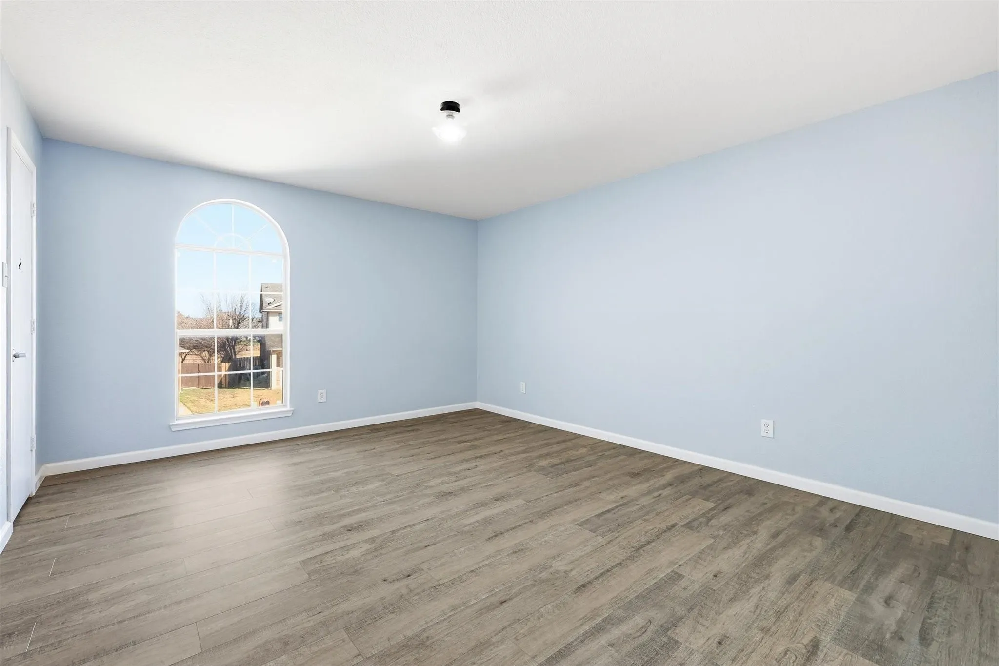 Unfurnished room featuring wood finished floors