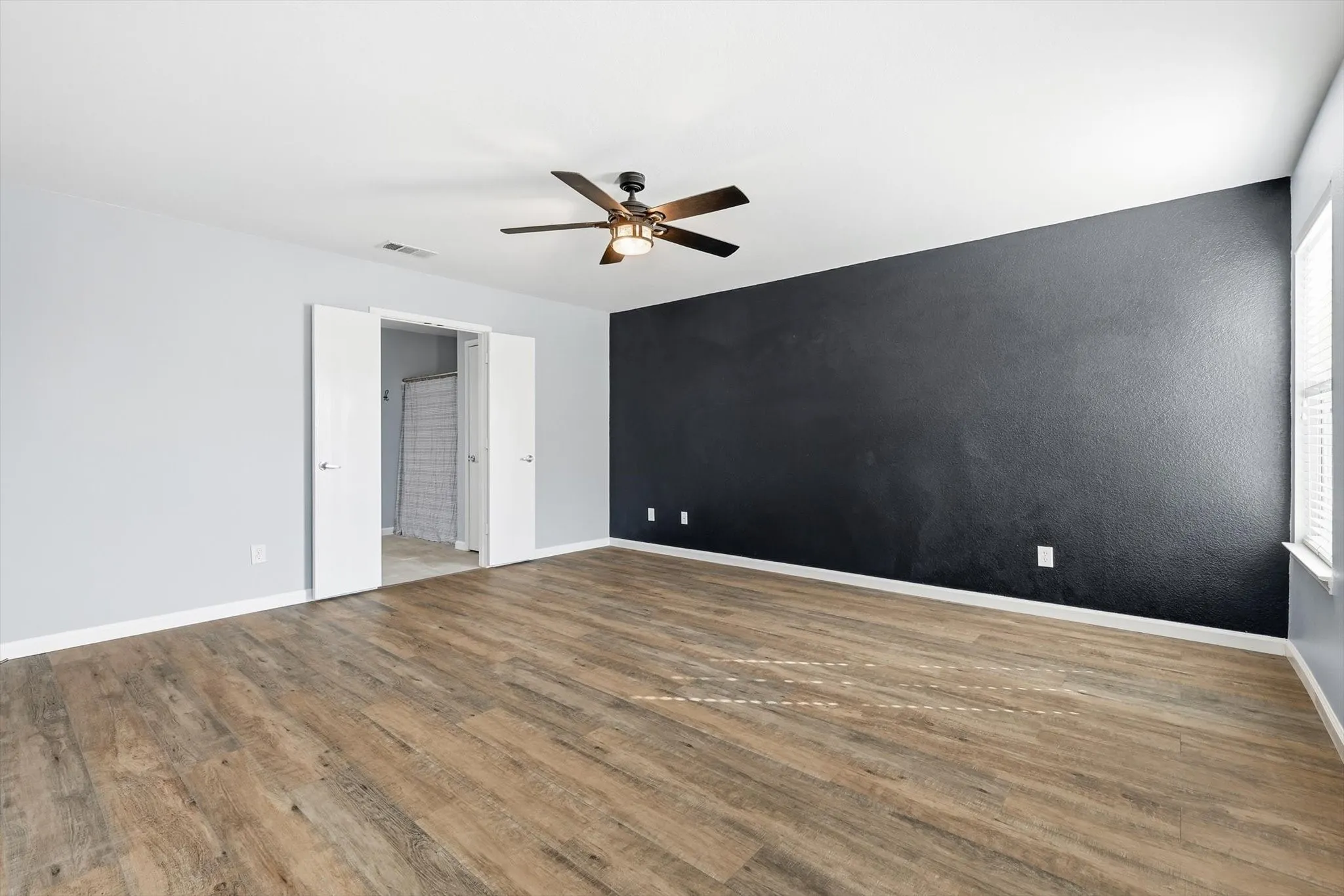 Unfurnished room featuring wood finished floors