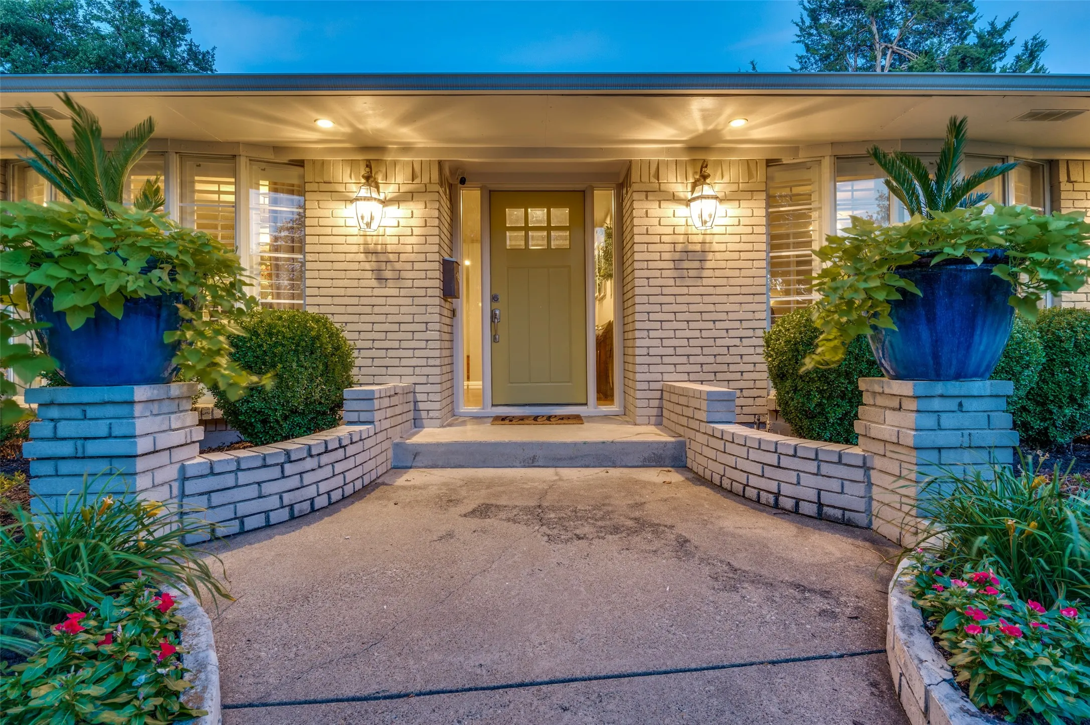 View of exterior entry with brick siding