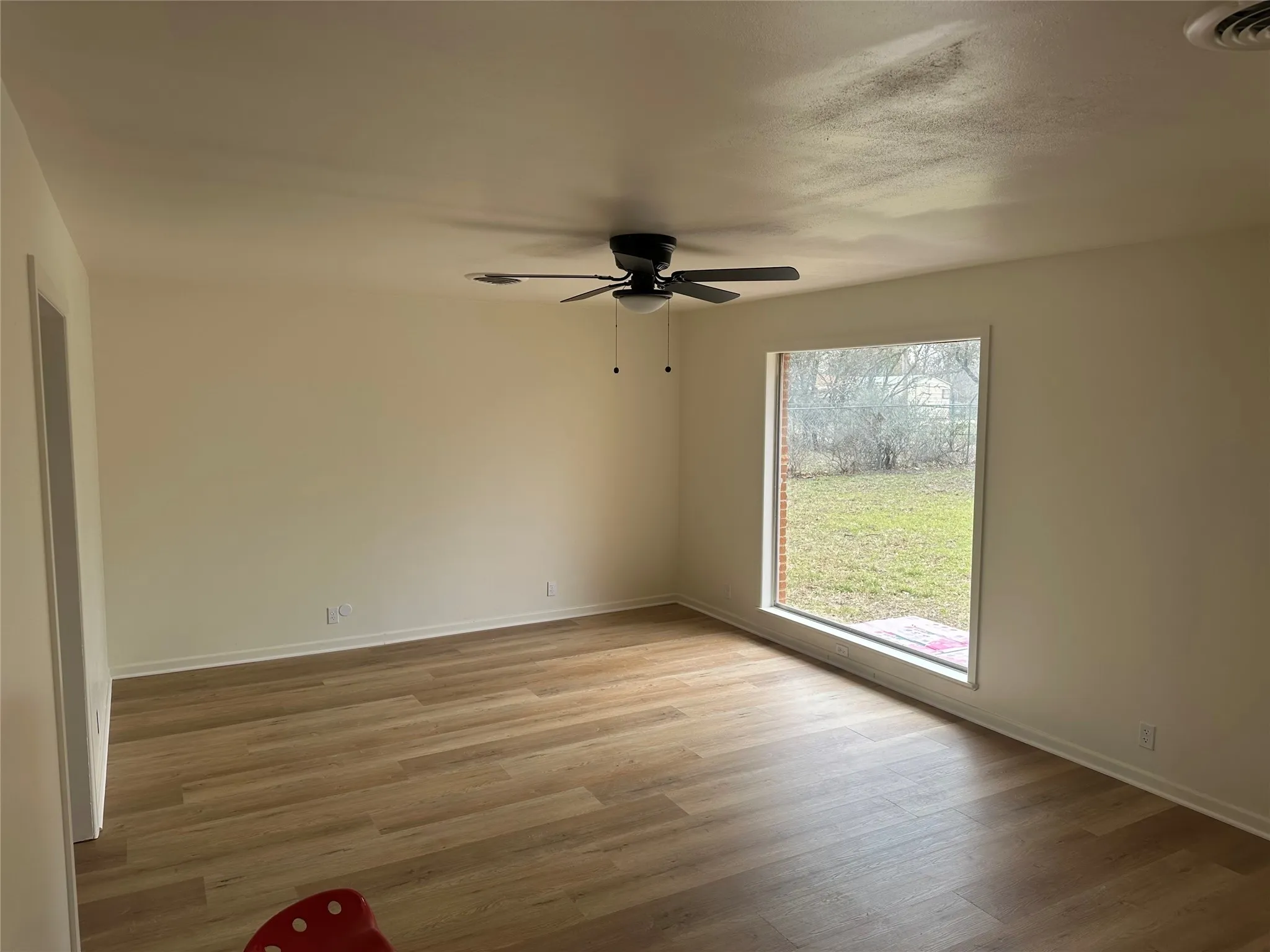 room featuring ceiling fan and light wood-style flooring