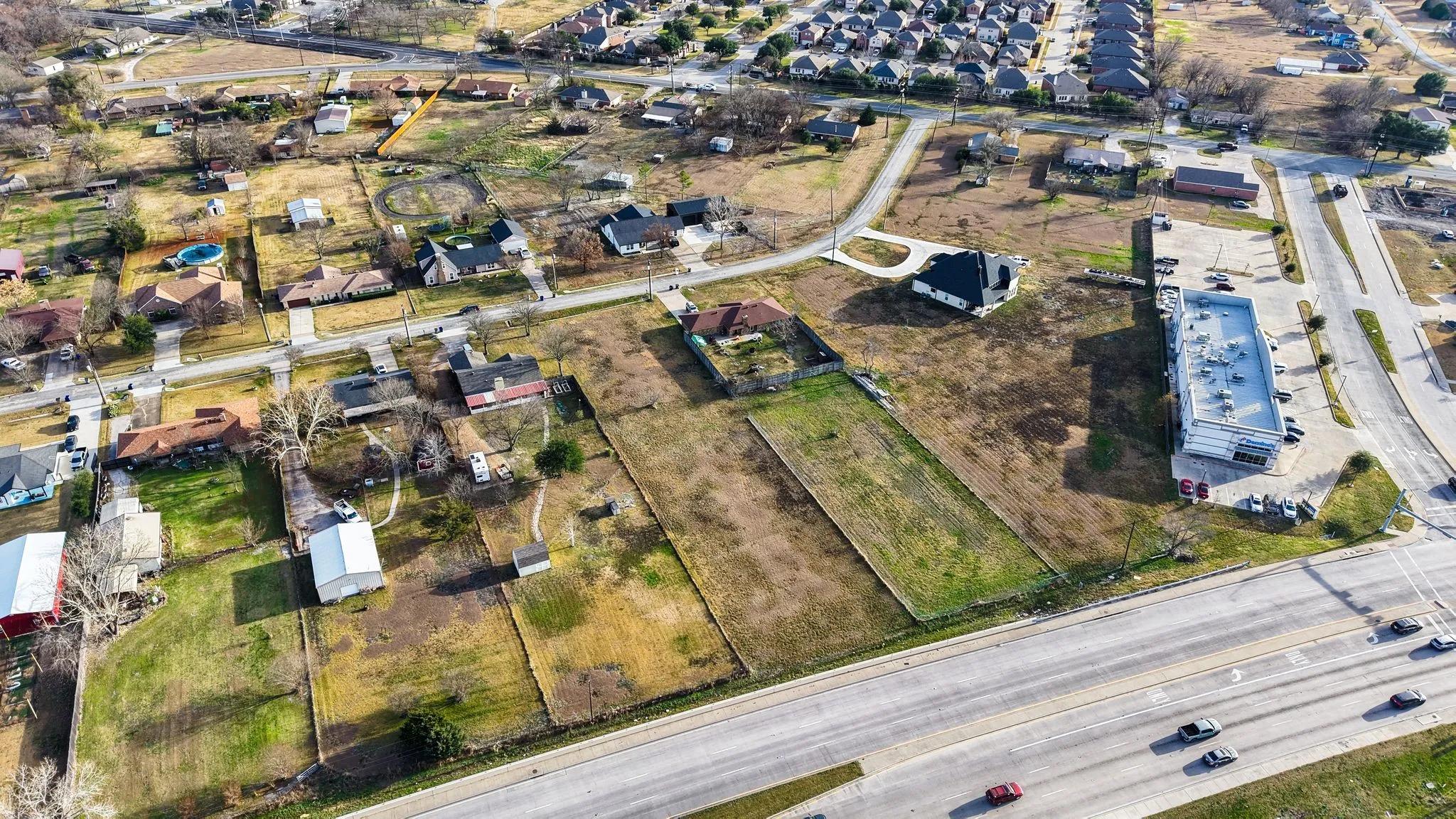 View of property location with nearby suburban area
