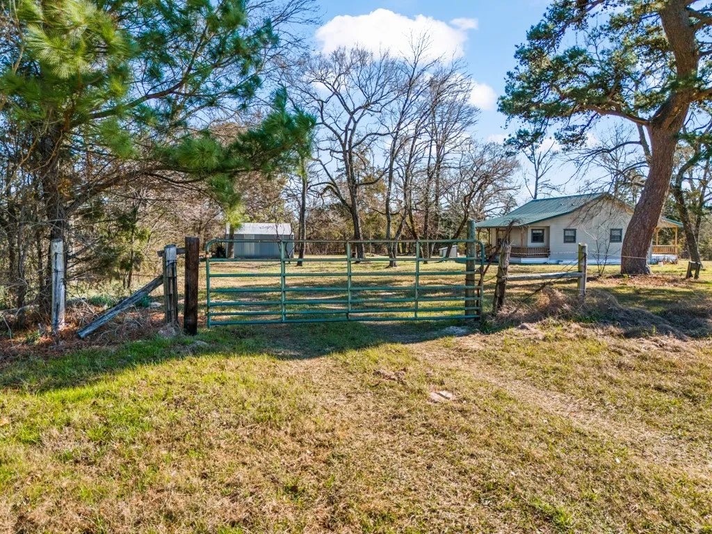 View of yard featuring a gate
